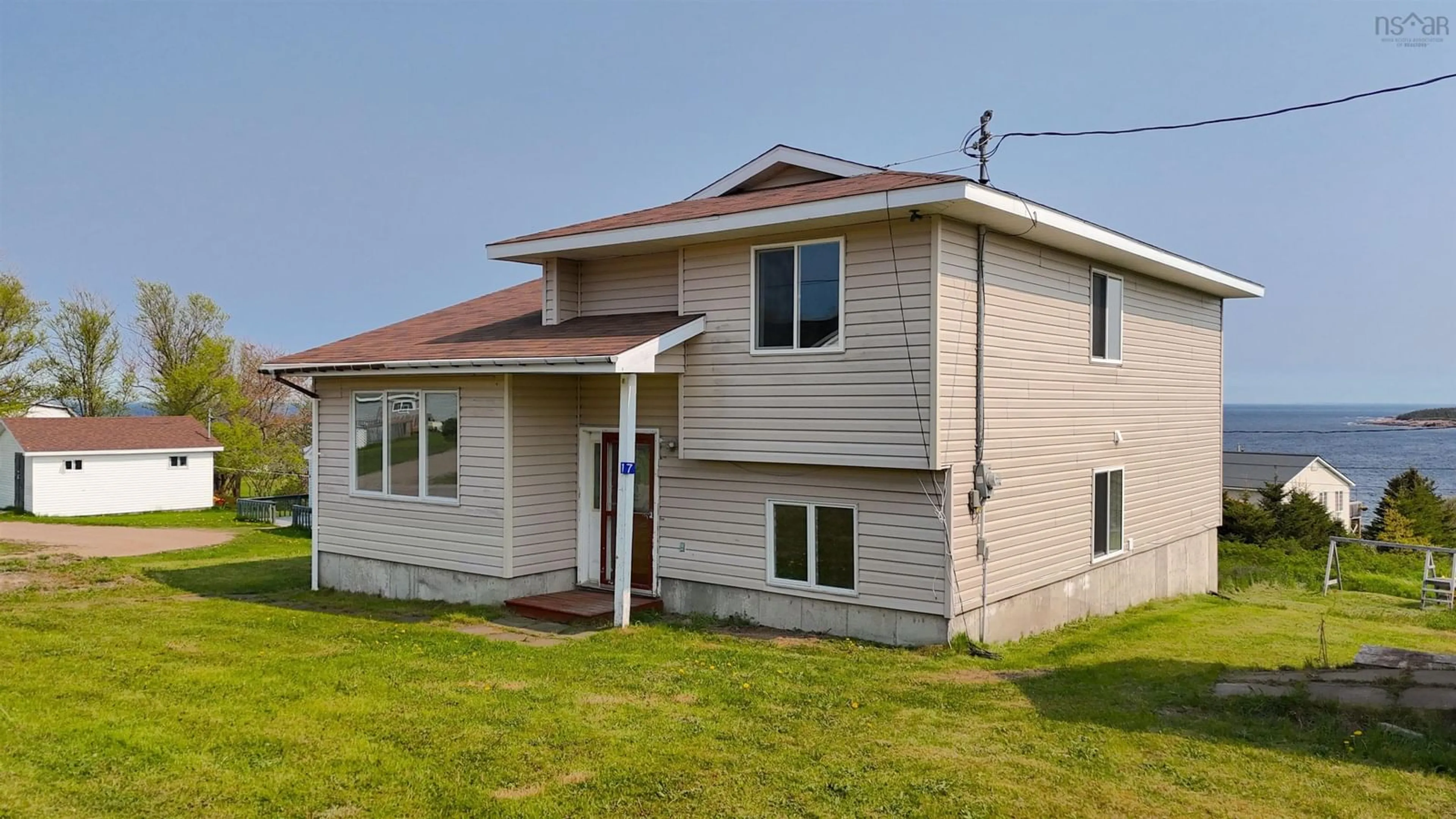 Home with vinyl exterior material, building for 17 Cyrils Dr, Neils Harbour Nova Scotia B0C 1N0