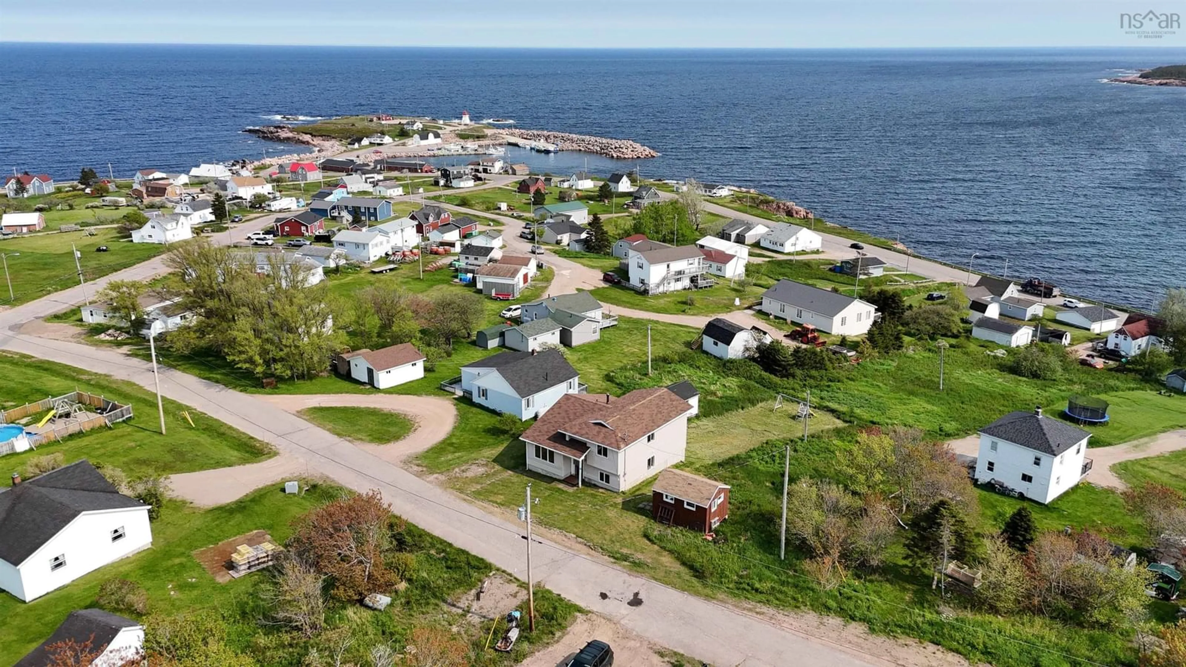 A pic from outside/outdoor area/front of a property/back of a property/a pic from drone, street for 17 Cyrils Dr, Neils Harbour Nova Scotia B0C 1N0