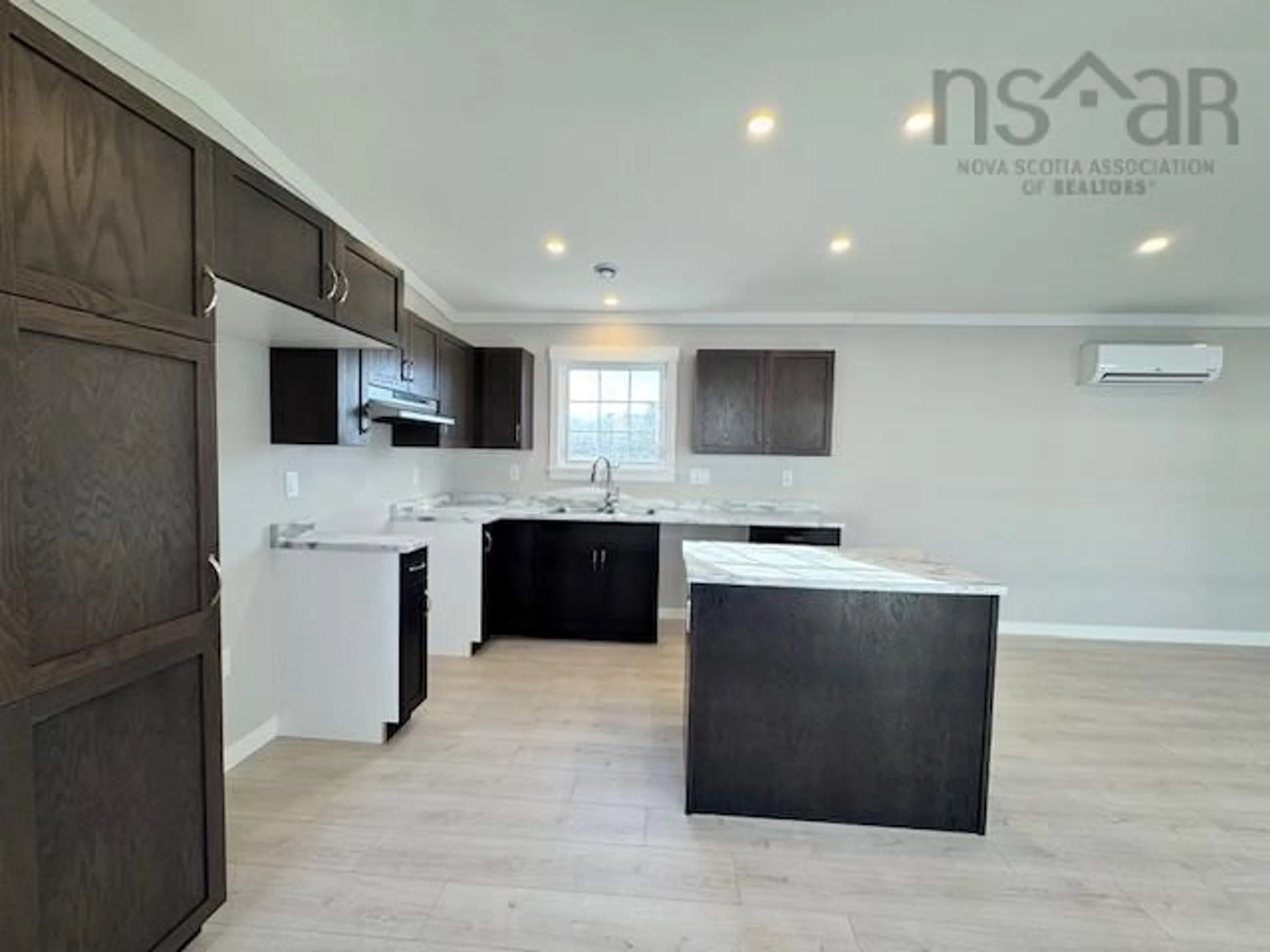 Open concept kitchen, wood/laminate floor for 4 Owen Ave, Mount Uniacke Nova Scotia B0N 1Z0