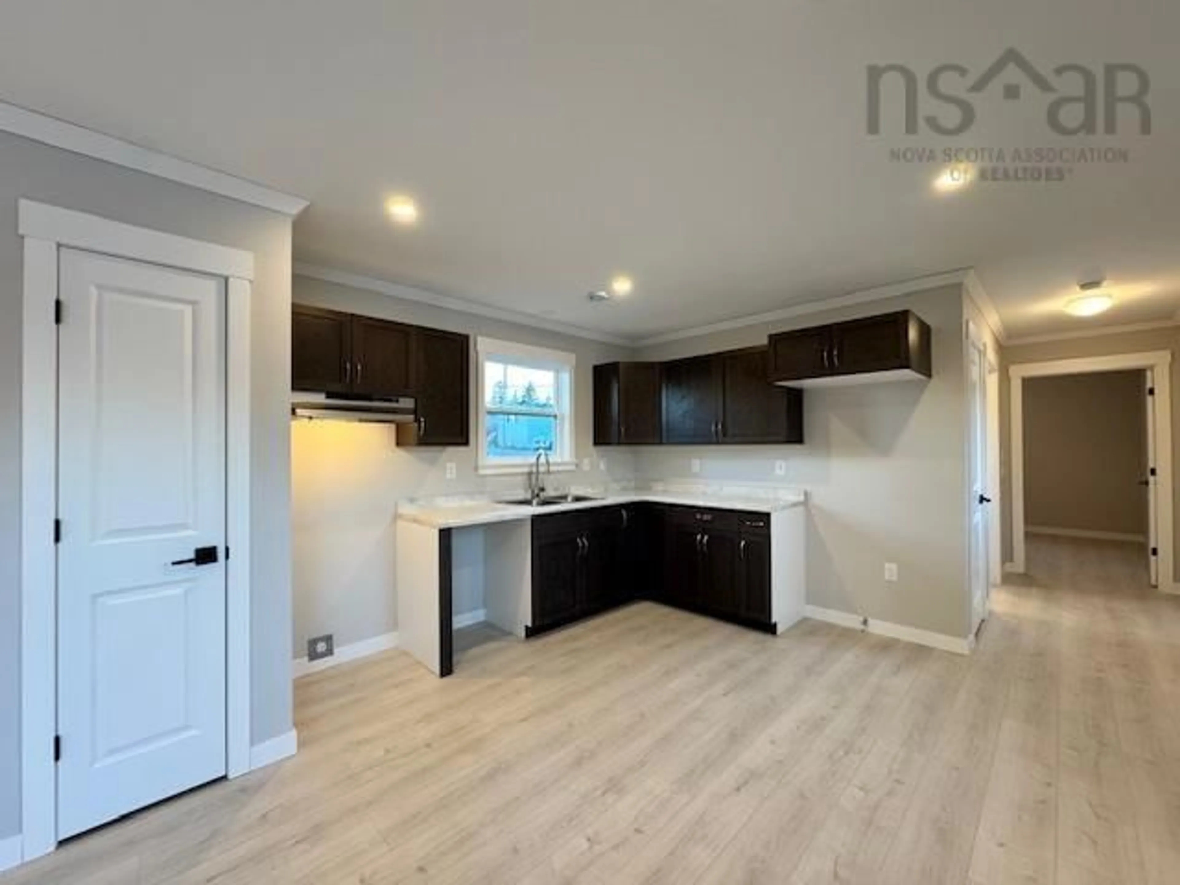 Open concept kitchen, wood/laminate floor for 18 Bruce St, Mount Uniacke Nova Scotia B0N 1Z0