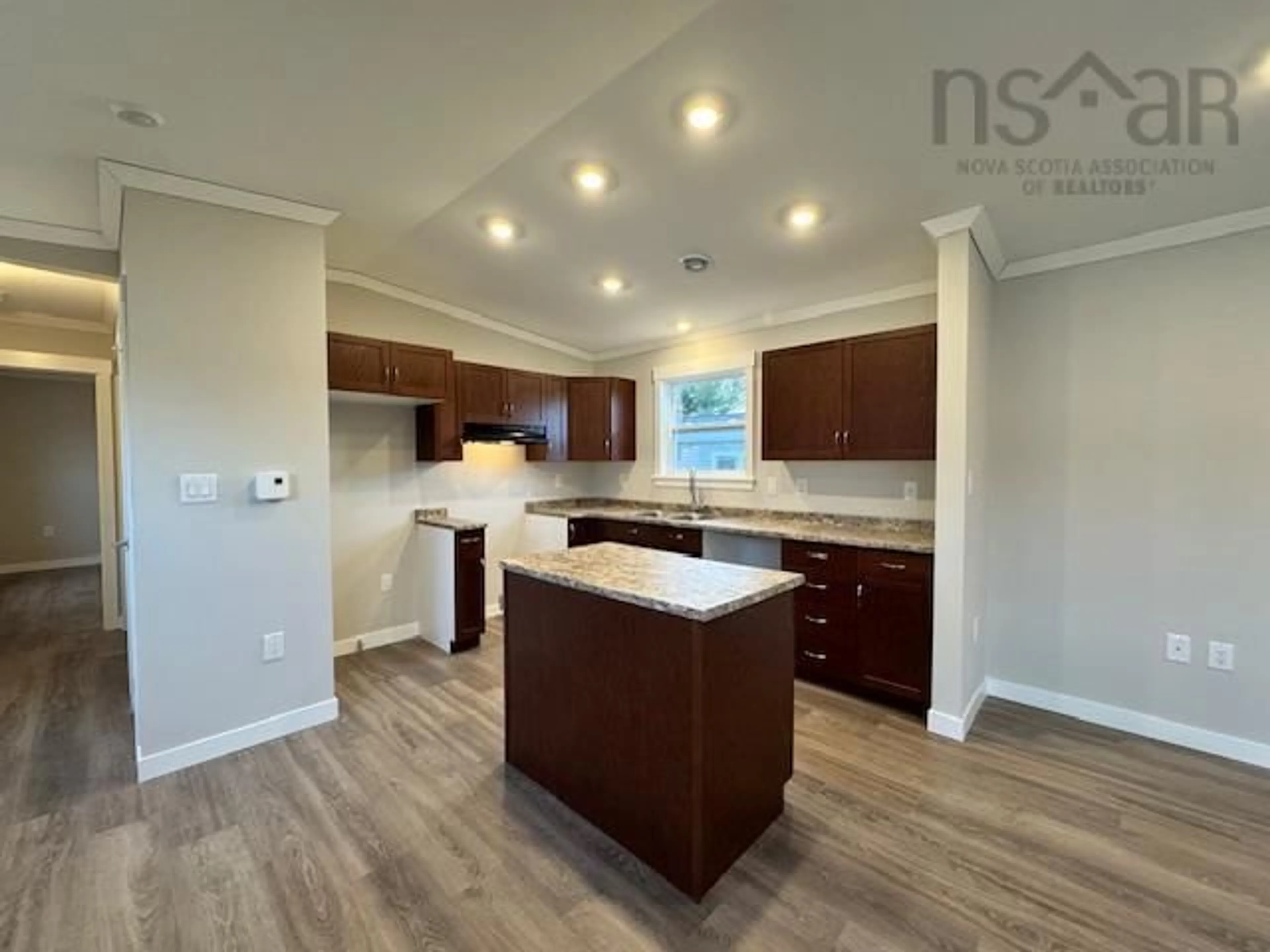 Open concept kitchen, wood/laminate floor for 6 Christopher Ave, Mount Uniacke Nova Scotia B0N 1Z0