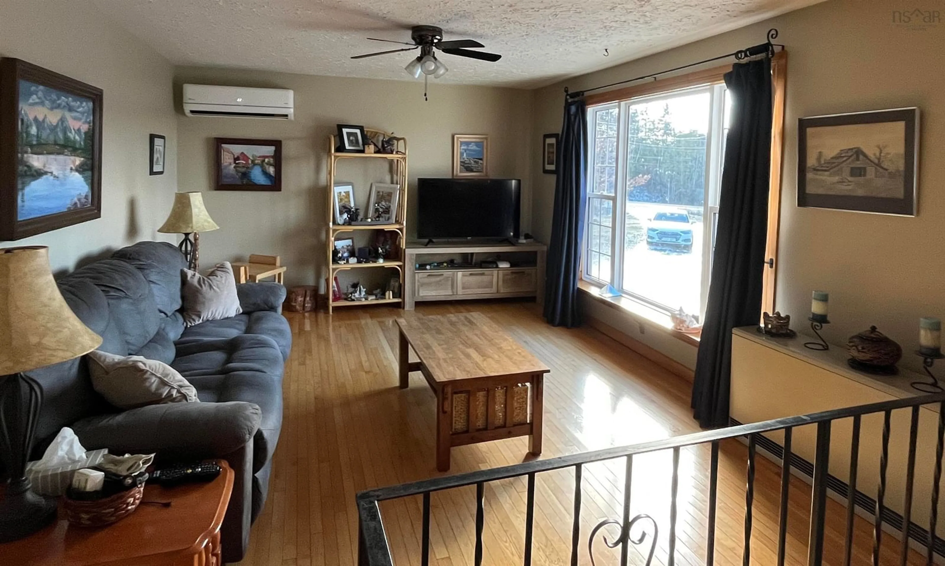 Living room with furniture, wood/laminate floor for 1163 Maclellans Brook Rd, Stellarton Nova Scotia B2H 5C7