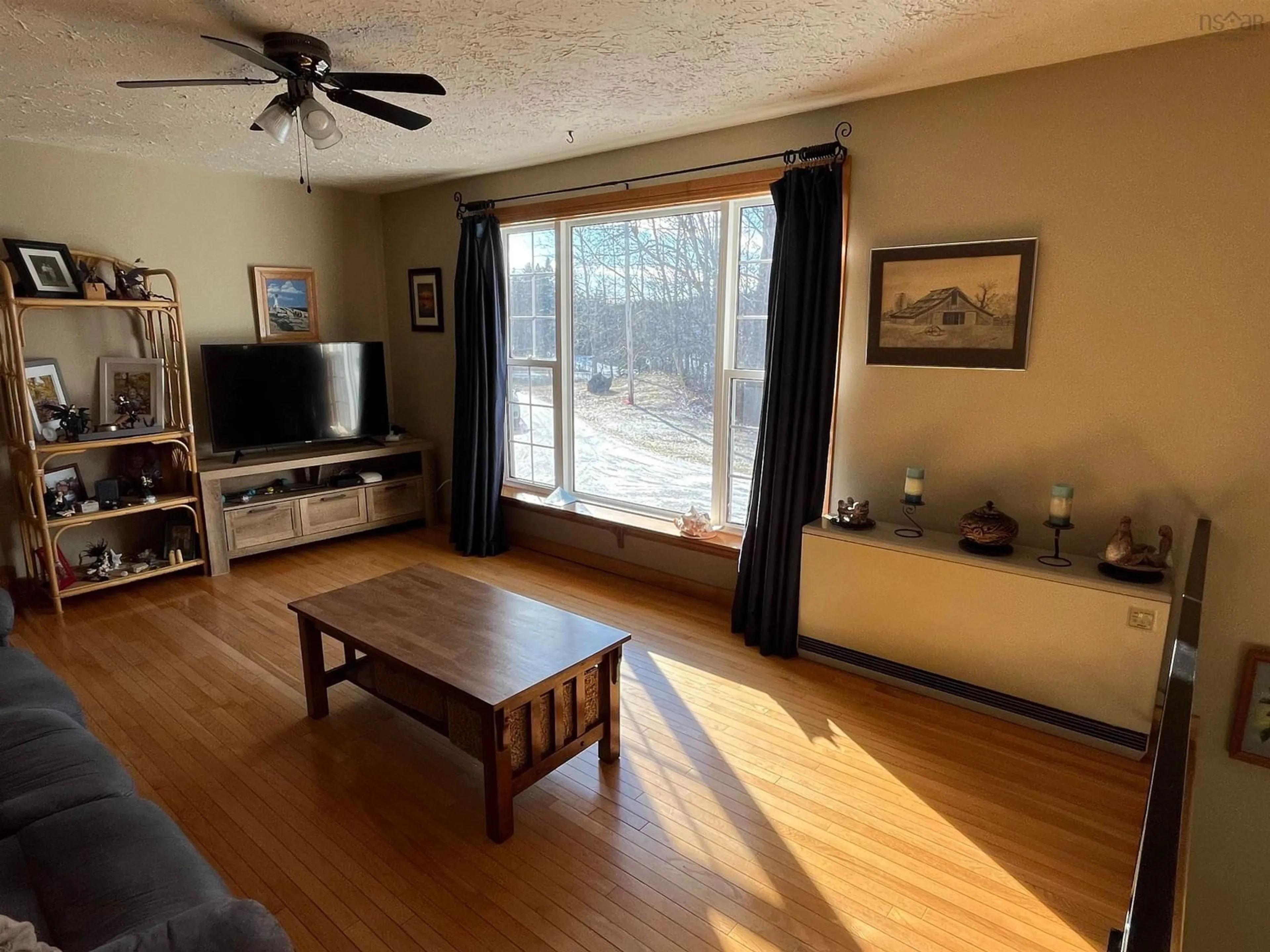 Living room with furniture, wood/laminate floor for 1163 Maclellans Brook Rd, Stellarton Nova Scotia B2H 5C7