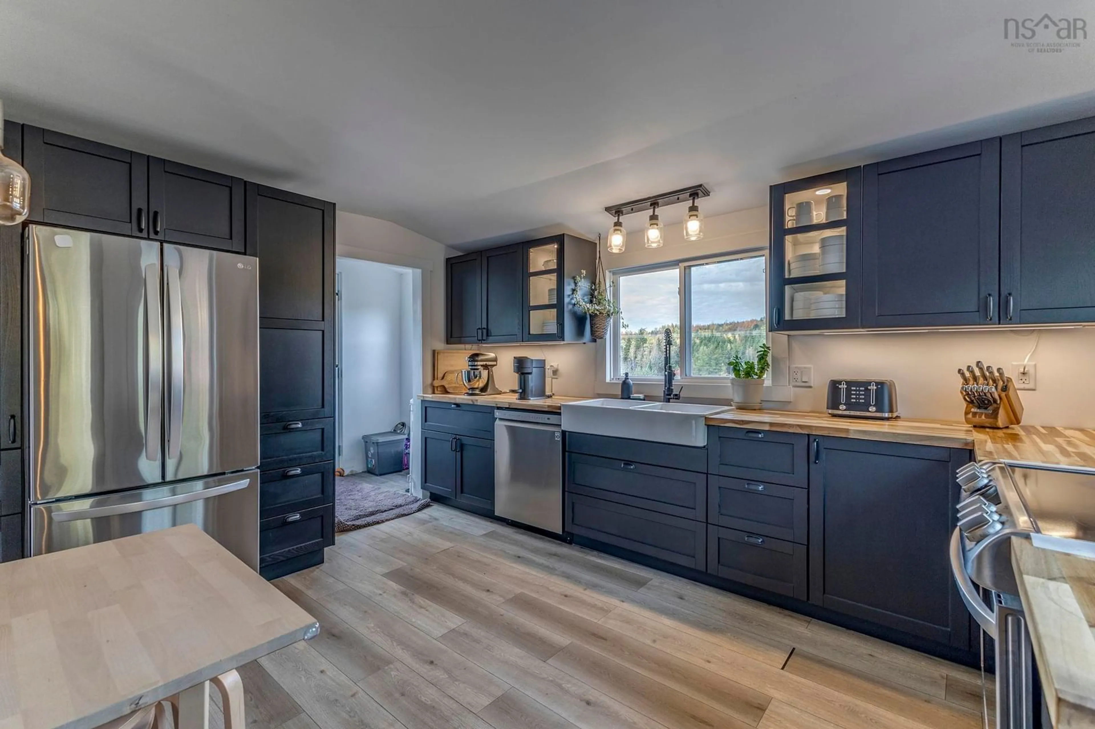 Open concept kitchen, wood/laminate floor for 1329 Highway 321, River Philip Nova Scotia B0M 1V0