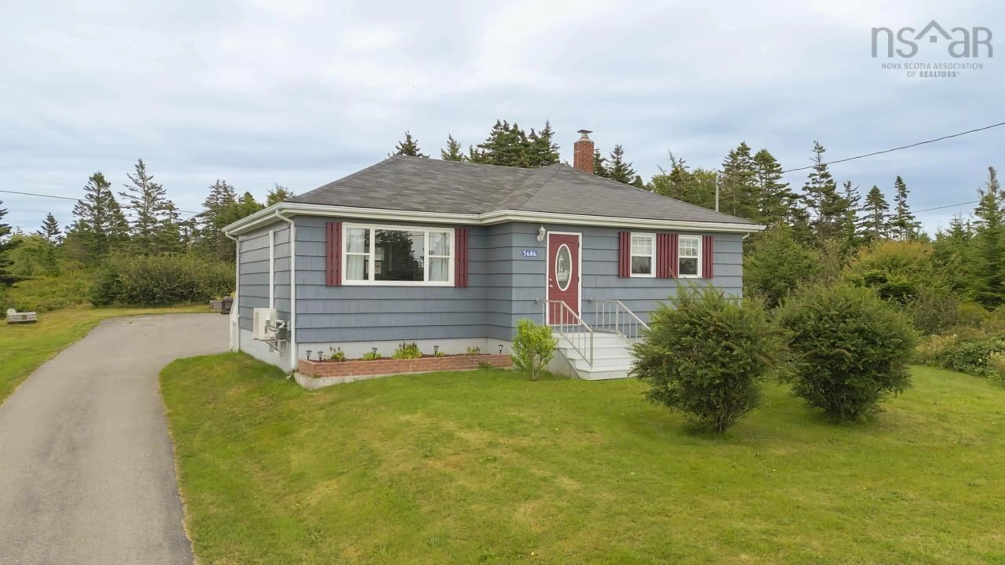 Home with vinyl exterior material, street for 5686 Highway 1, Mavillette Nova Scotia B5A 5B3