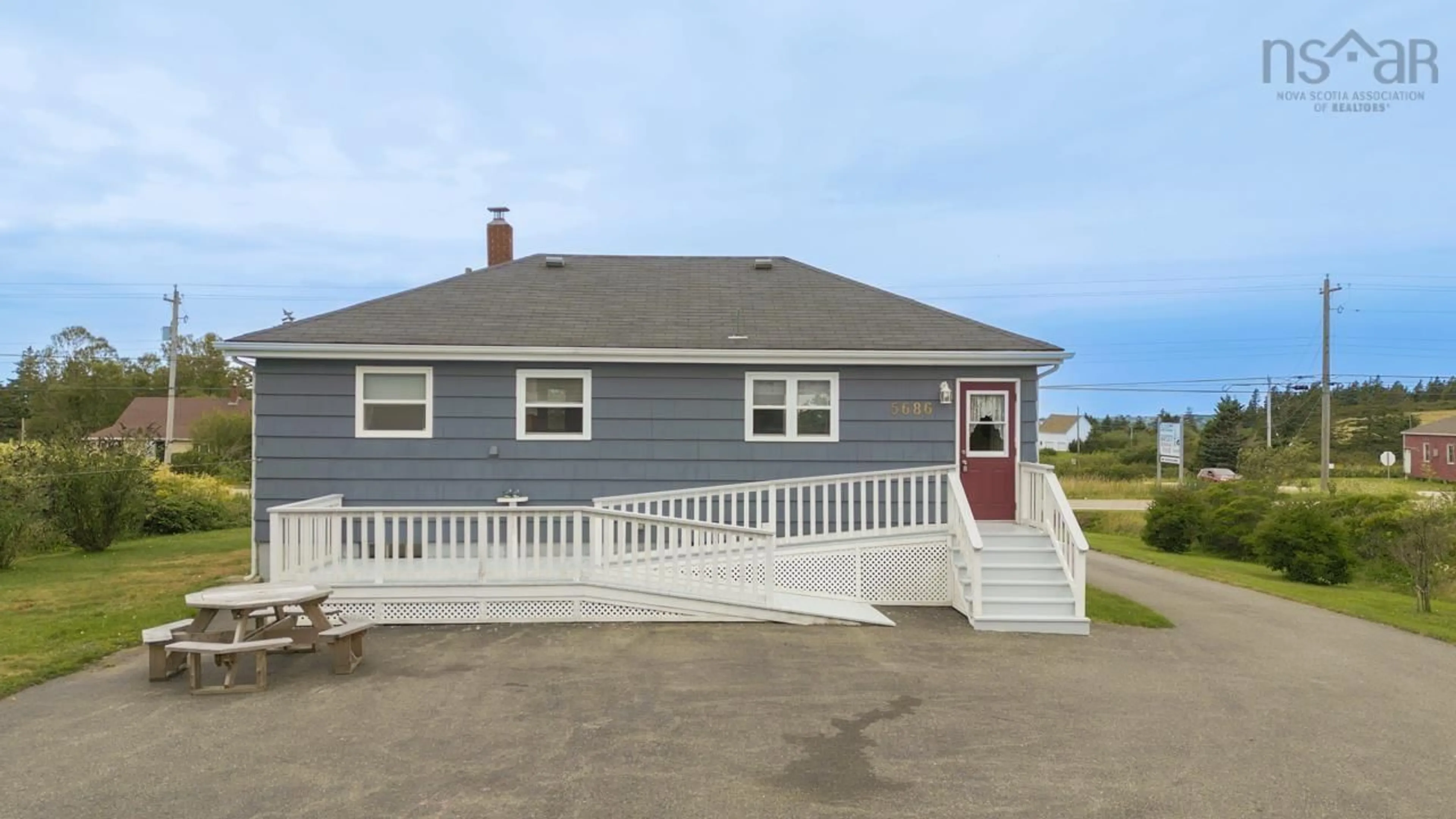 Home with vinyl exterior material, street for 5686 Highway 1, Mavillette Nova Scotia B5A 5B3