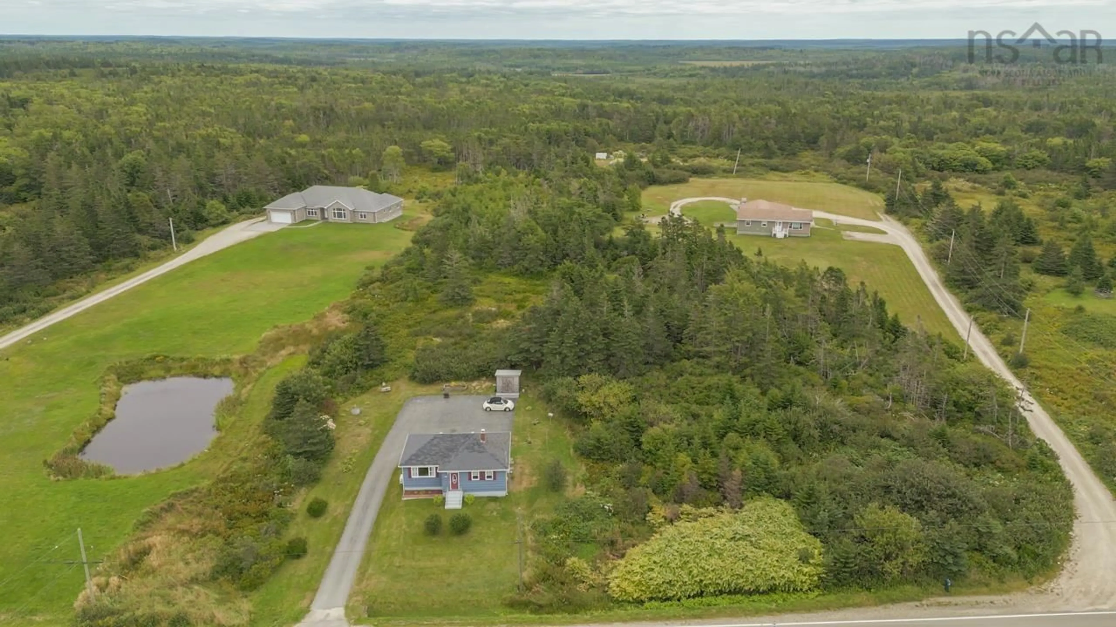 A pic from outside/outdoor area/front of a property/back of a property/a pic from drone, water/lake/river/ocean view for 5686 Highway 1, Mavillette Nova Scotia B5A 5B3