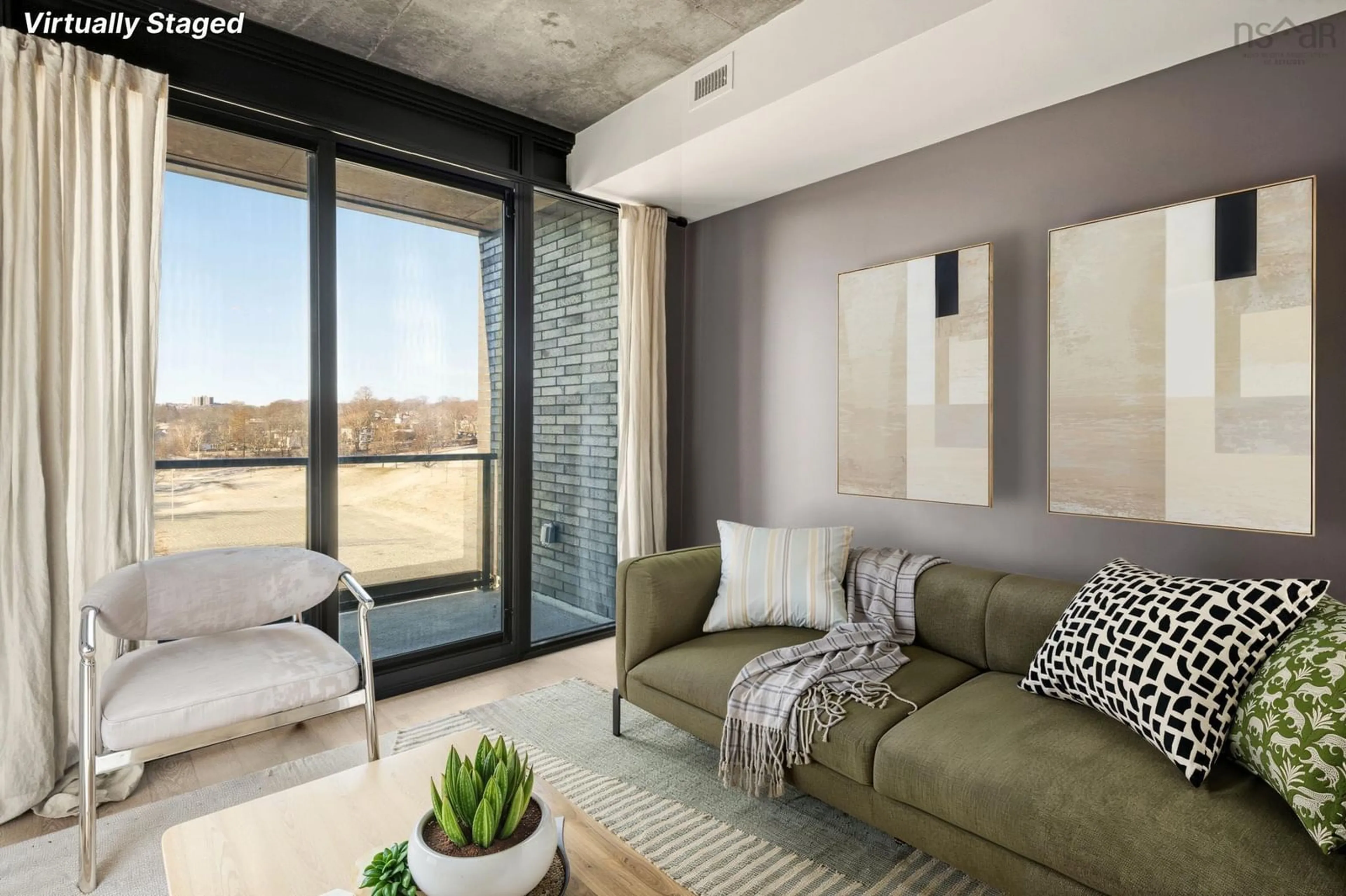 Living room with furniture, cement floor for 1048 Wellington St #618, Halifax Nova Scotia B3H 0C2