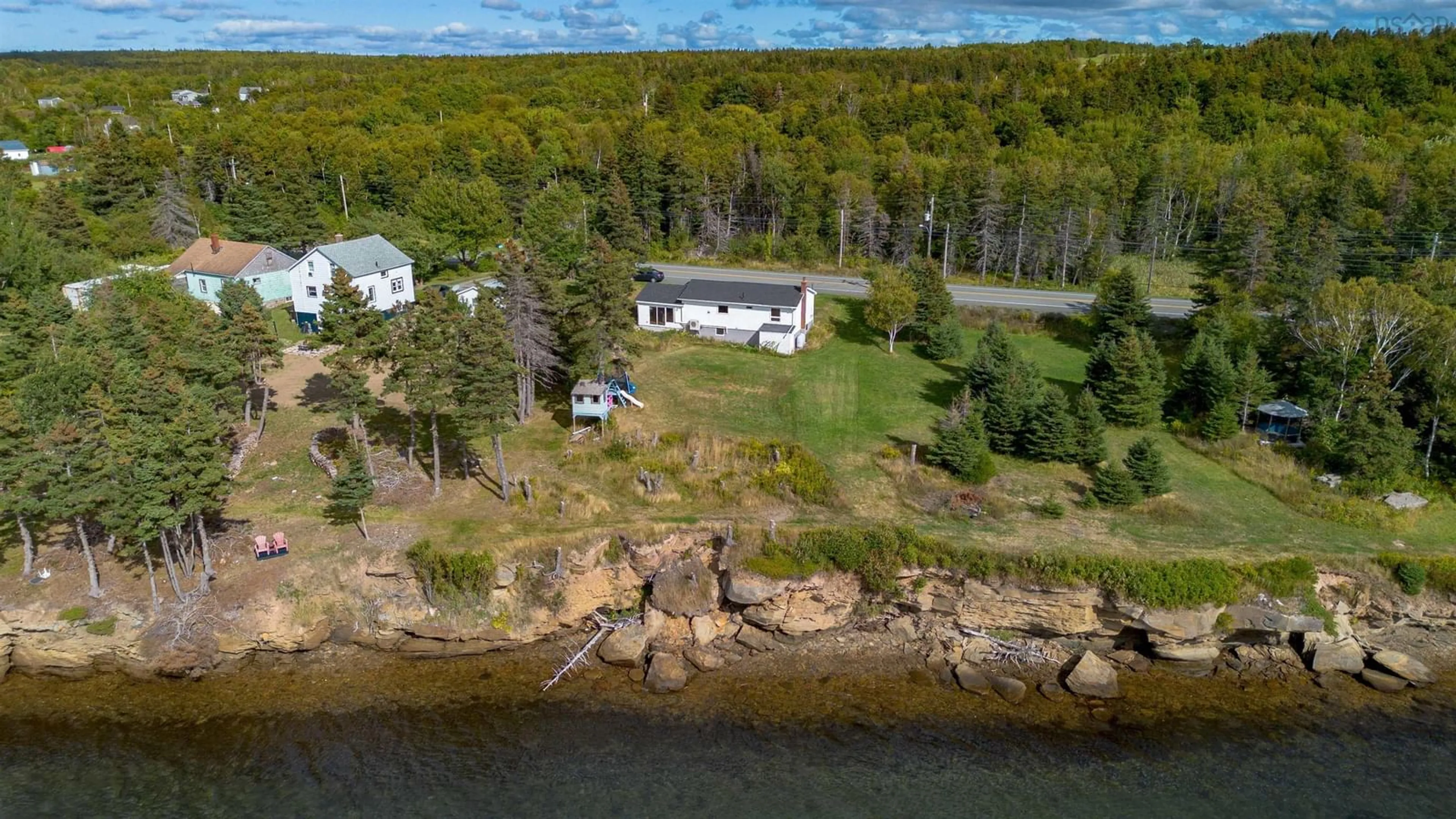 A pic from outside/outdoor area/front of a property/back of a property/a pic from drone, water/lake/river/ocean view for 2339 New Waterford Hwy, South Bar Nova Scotia B1N 3H9