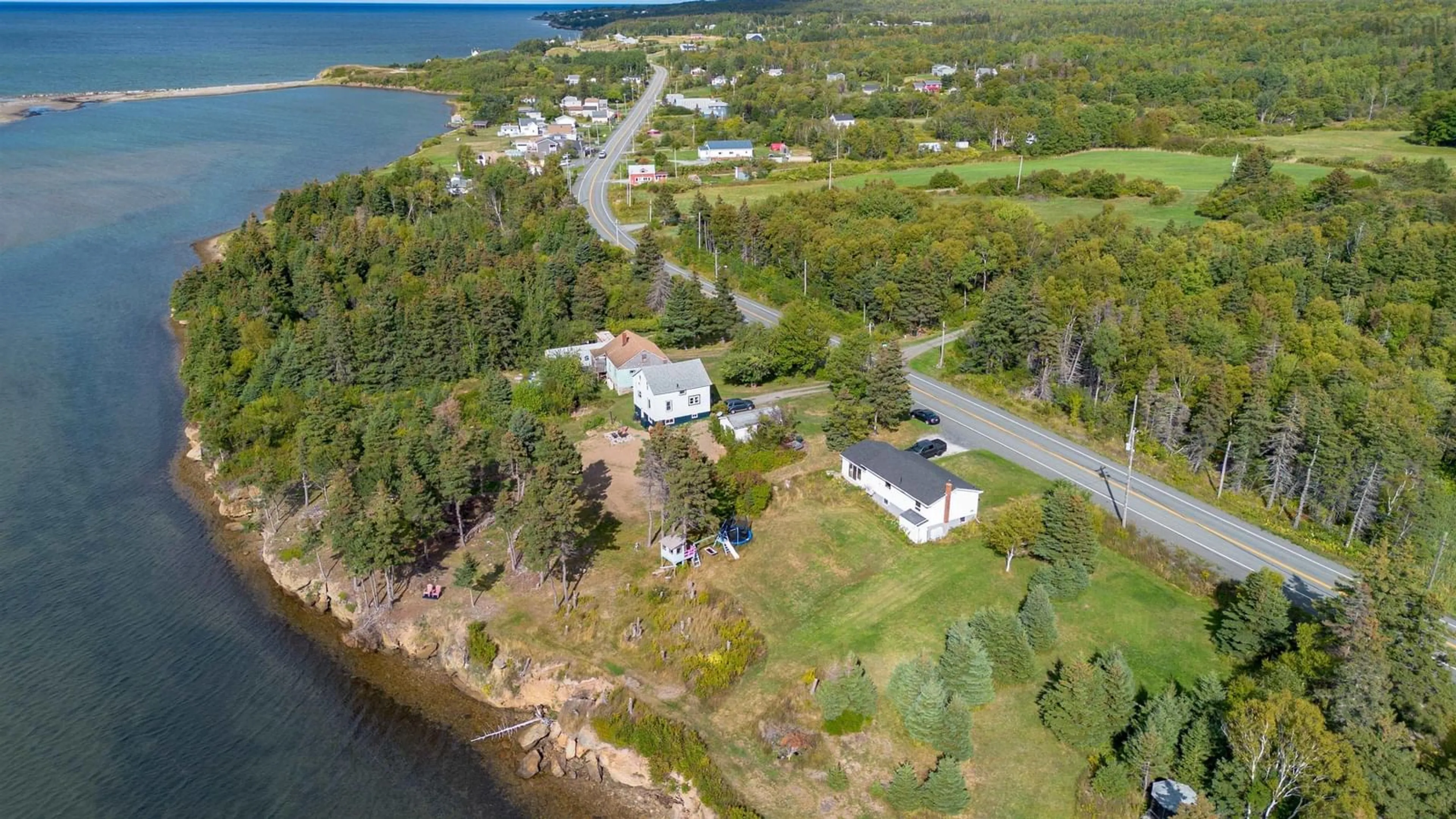 A pic from outside/outdoor area/front of a property/back of a property/a pic from drone, water/lake/river/ocean view for 2339 New Waterford Hwy, South Bar Nova Scotia B1N 3H9