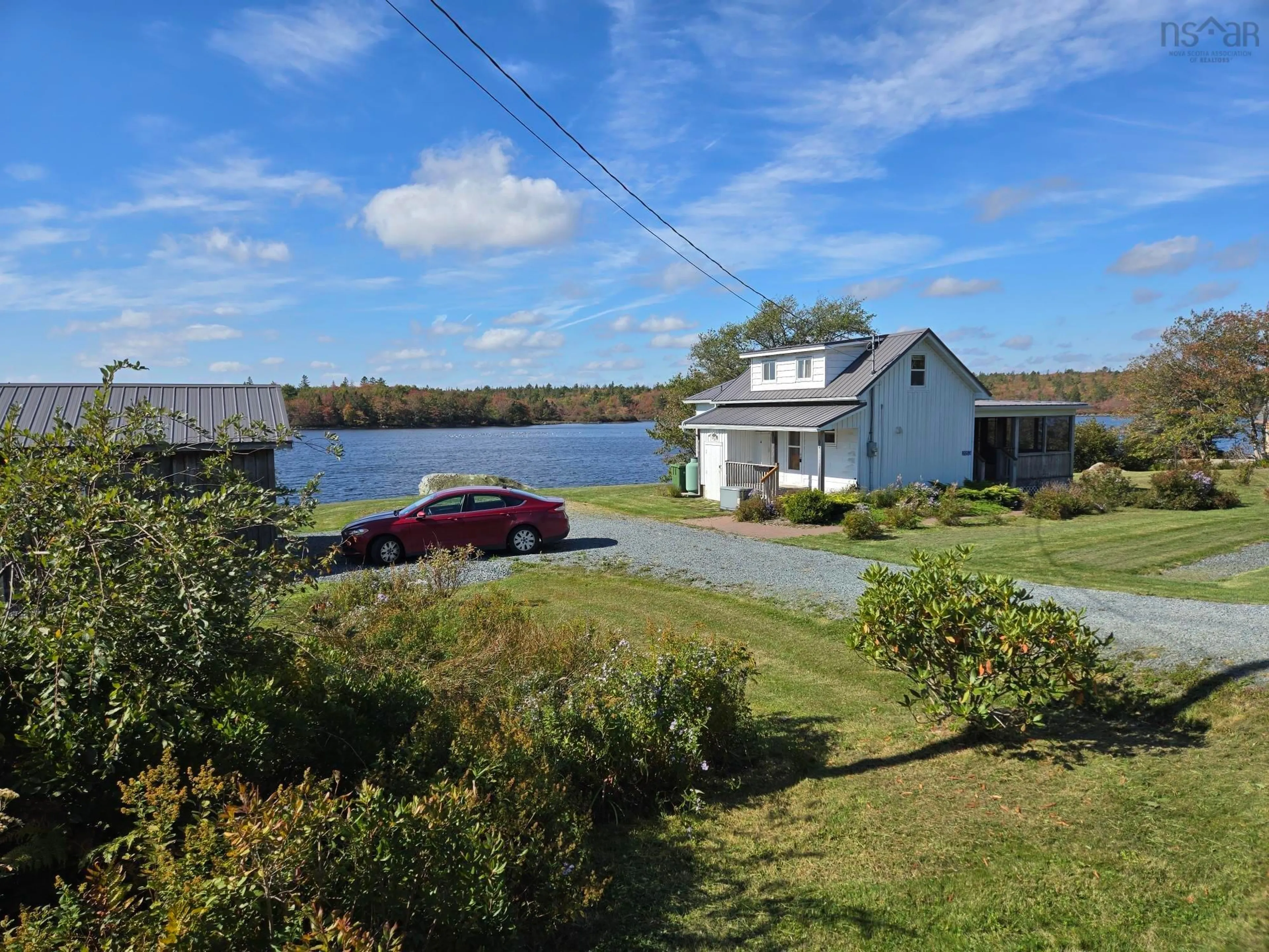 A pic from outside/outdoor area/front of a property/back of a property/a pic from drone, water/lake/river/ocean view for 2053 Eastern Shore Rd, West Berlin Nova Scotia B0J 1H0