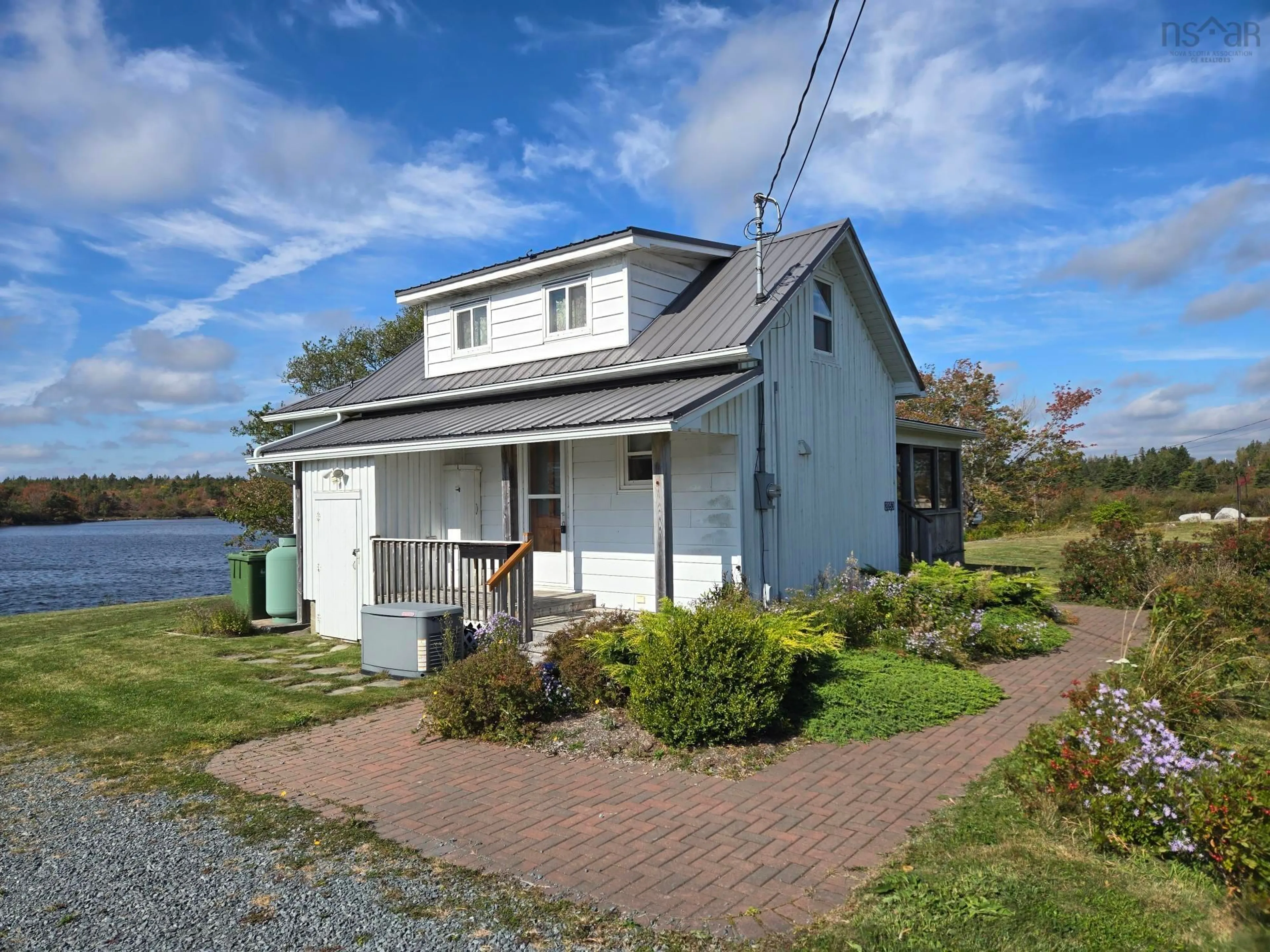 A pic from outside/outdoor area/front of a property/back of a property/a pic from drone, water/lake/river/ocean view for 2053 Eastern Shore Rd, West Berlin Nova Scotia B0J 1H0