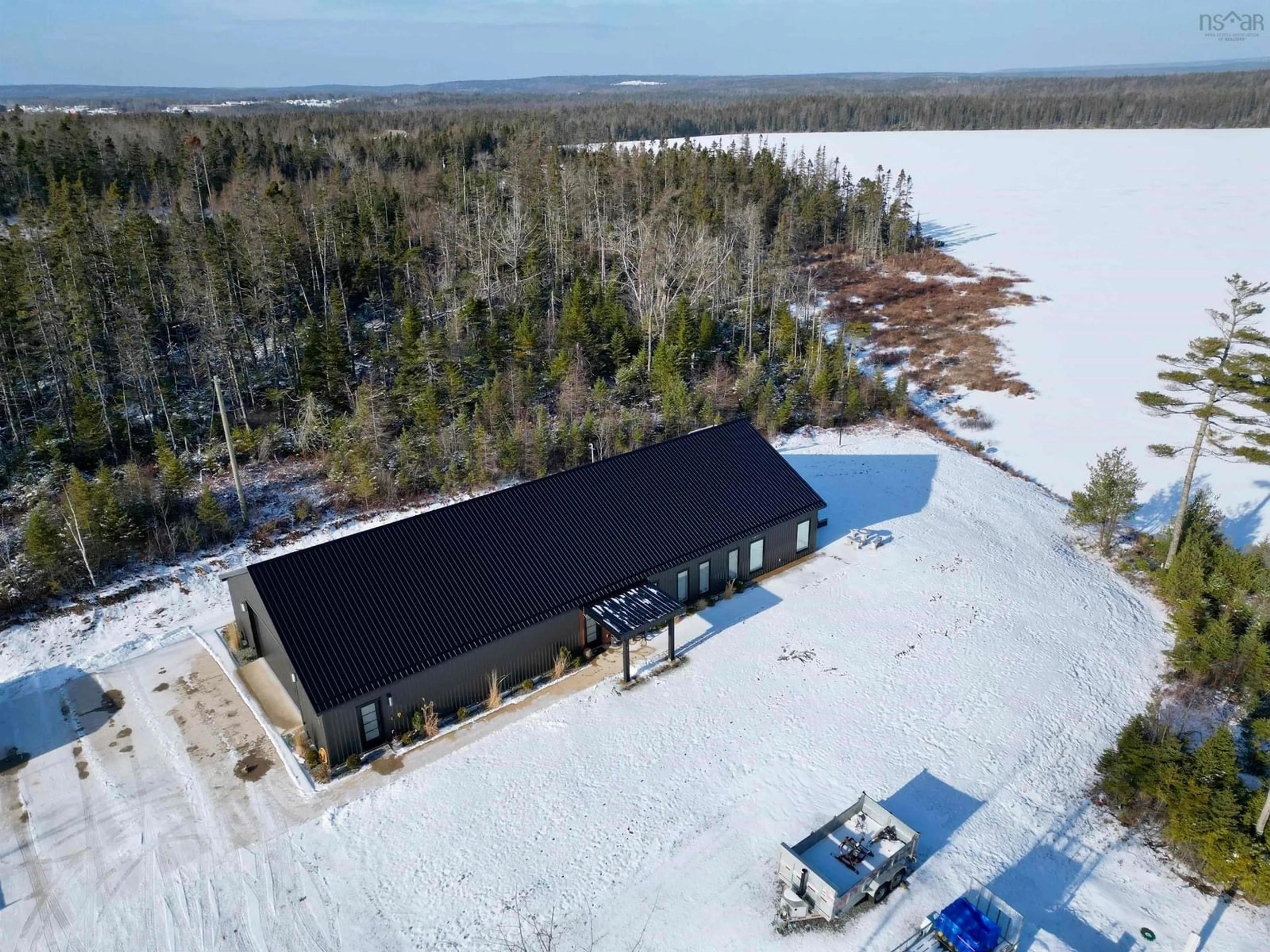 A pic from outside/outdoor area/front of a property/back of a property/a pic from drone, water/lake/river/ocean view for 381 Grandiqe Ferry Rd., Louisdale Nova Scotia B0E 1V0