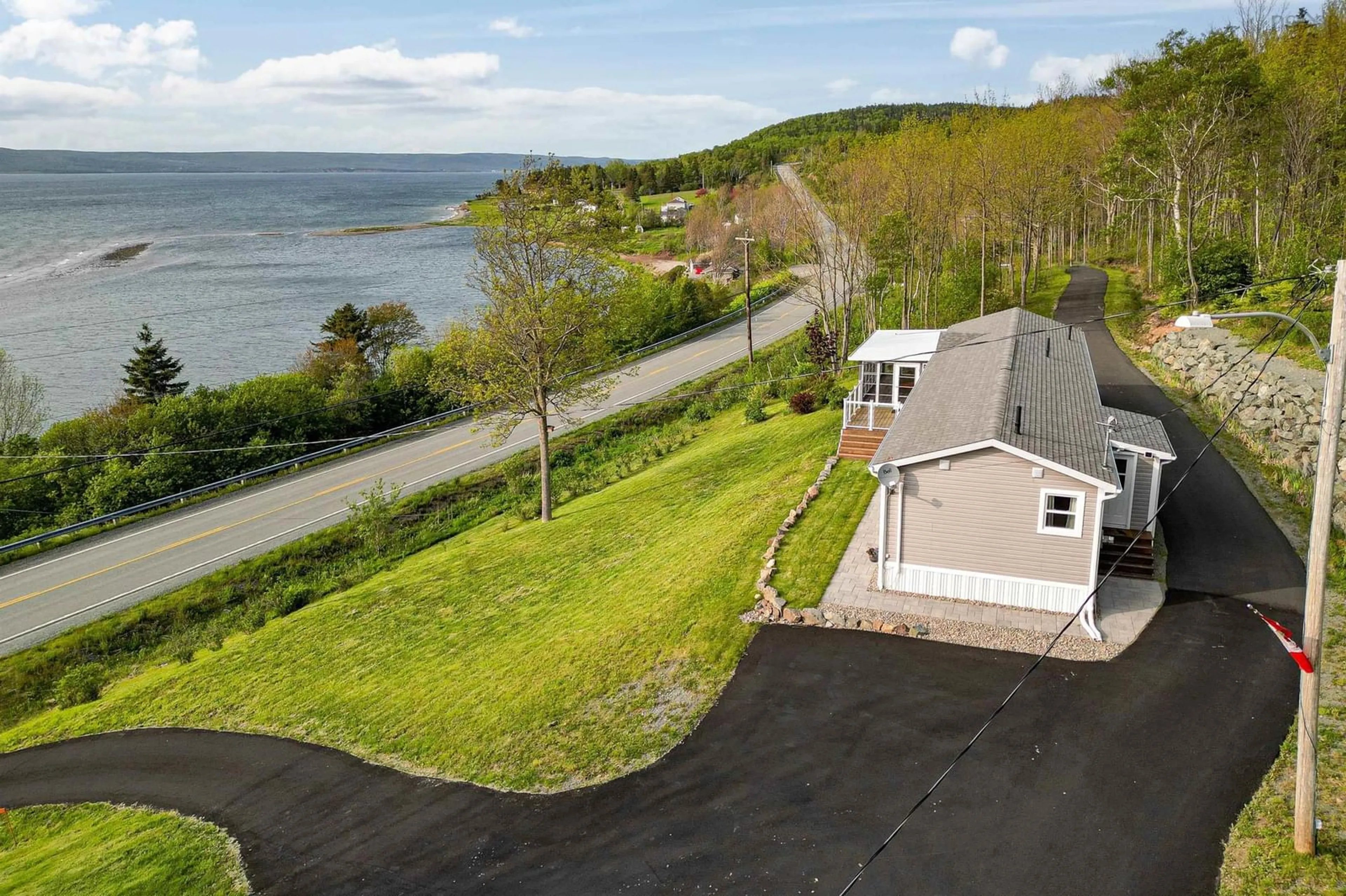 A pic from outside/outdoor area/front of a property/back of a property/a pic from drone, water/lake/river/ocean view for 9653 East Bay Hwy, Irishvale Nova Scotia B1J 2B3