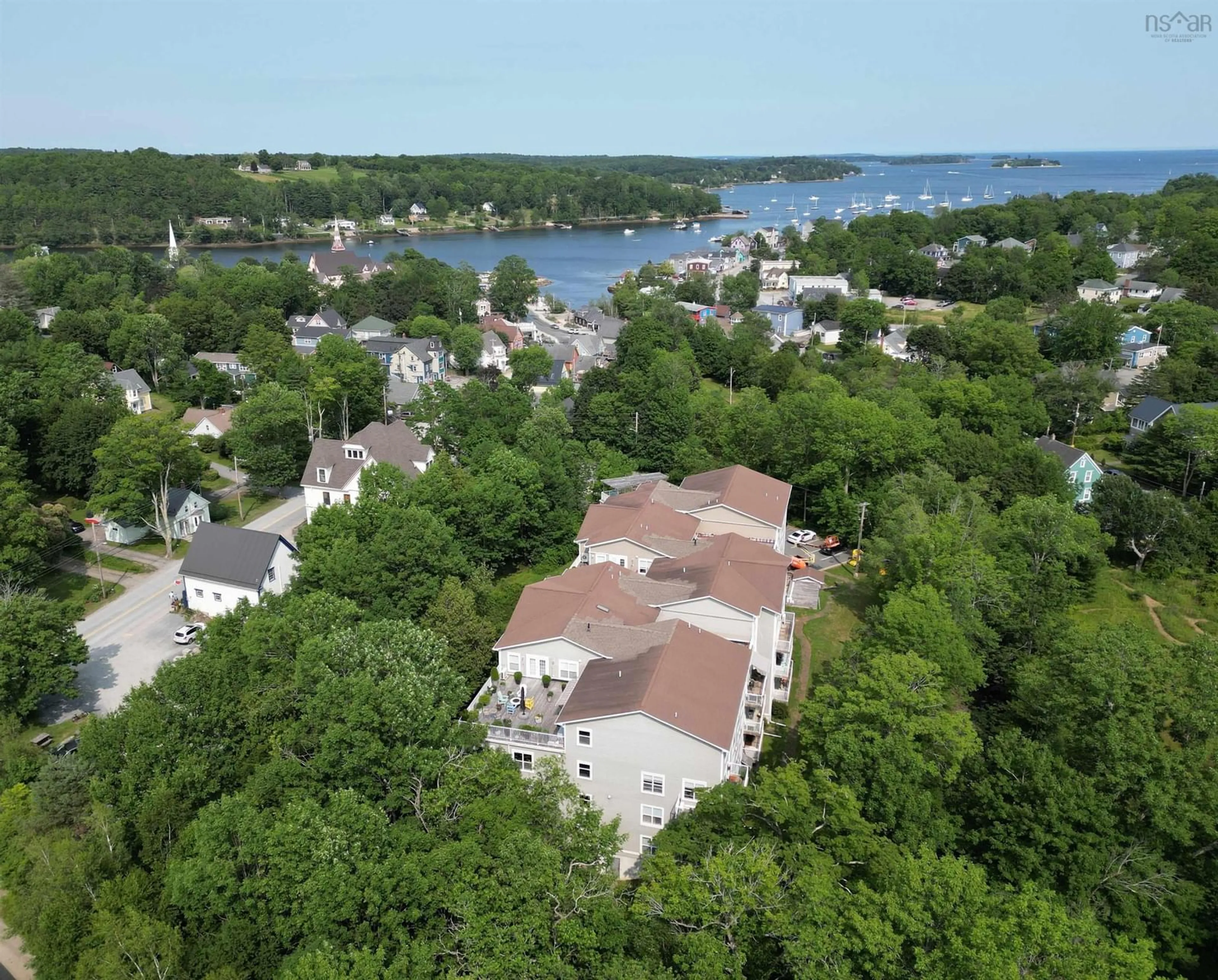 A pic from outside/outdoor area/front of a property/back of a property/a pic from drone, water/lake/river/ocean view for 476 Main St #302, Mahone Bay Nova Scotia B0J 2E0