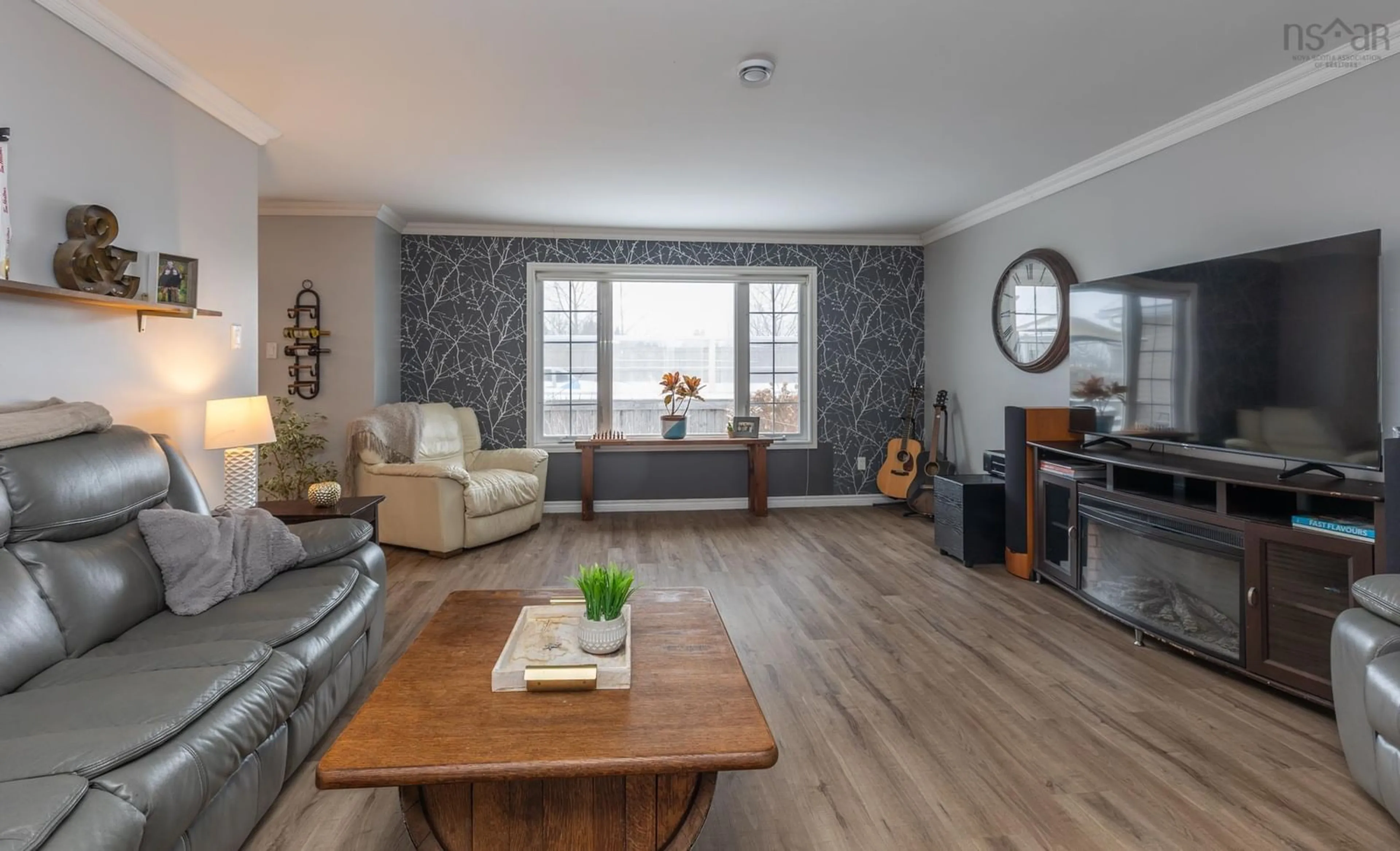 Living room with furniture, wood/laminate floor for 53 Colonial Ave, North Chegoggin Nova Scotia B5A 5K5