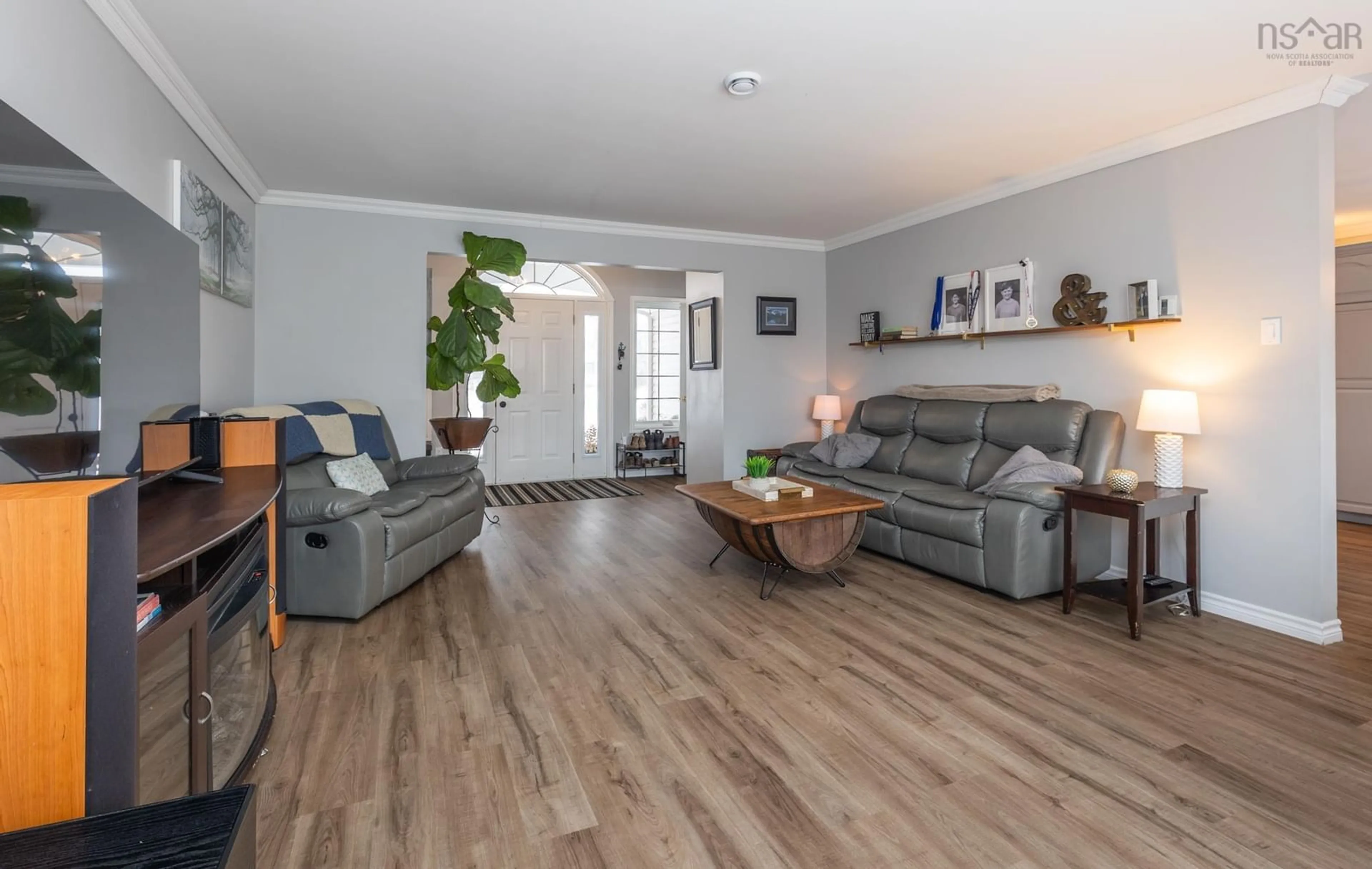 Living room with furniture, wood/laminate floor for 53 Colonial Ave, North Chegoggin Nova Scotia B5A 5K5