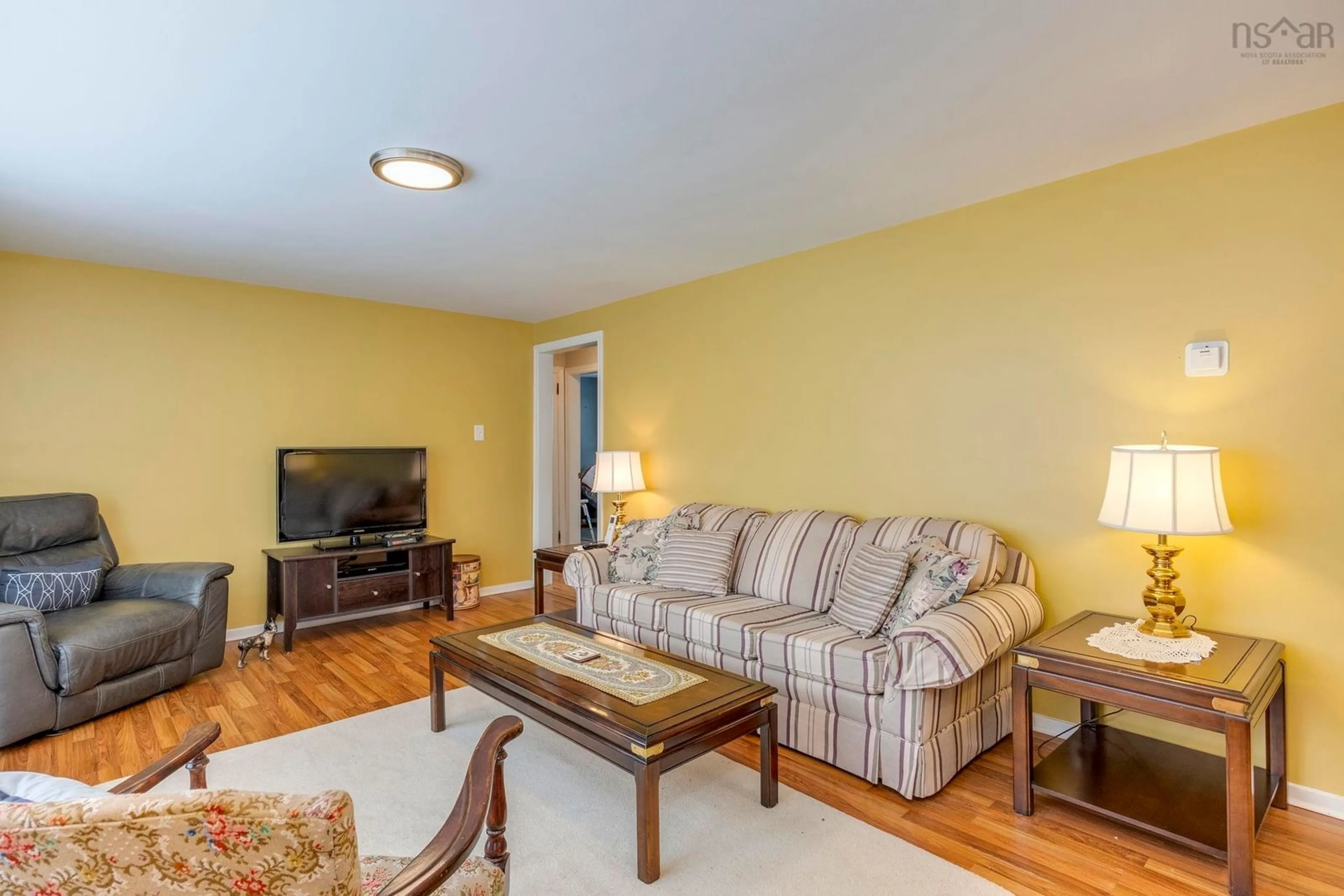 Living room with furniture, wood/laminate floor for 1166 Owen Rd, North Kentville Nova Scotia B4N 4H5