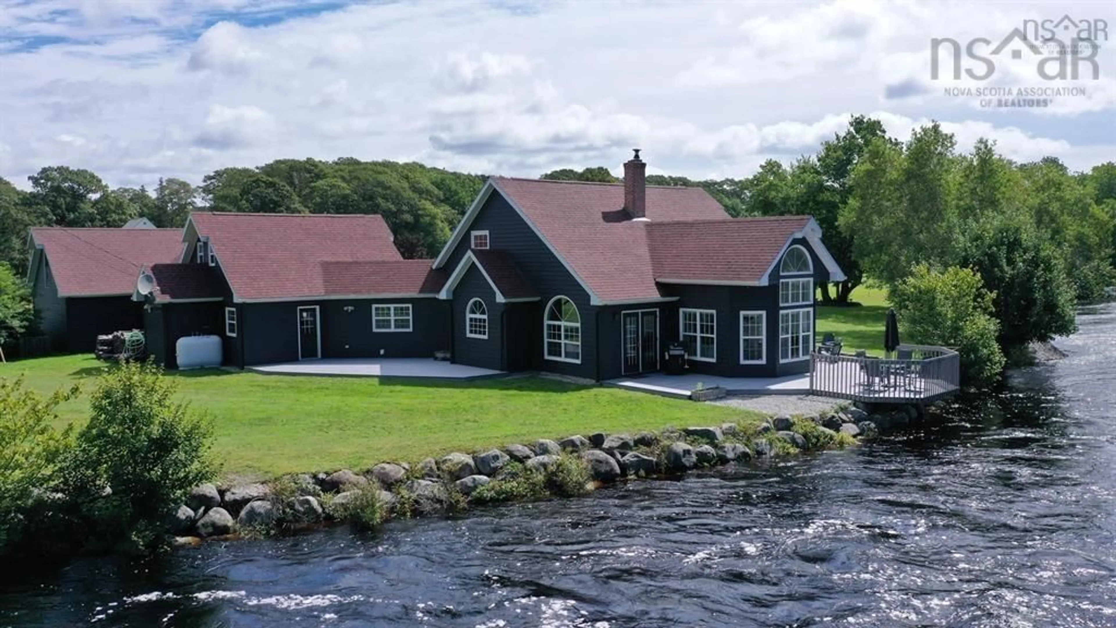 A pic from outside/outdoor area/front of a property/back of a property/a pic from drone, water/lake/river/ocean view for 41 Post Office Rd, Clyde River Nova Scotia B0W 1R0