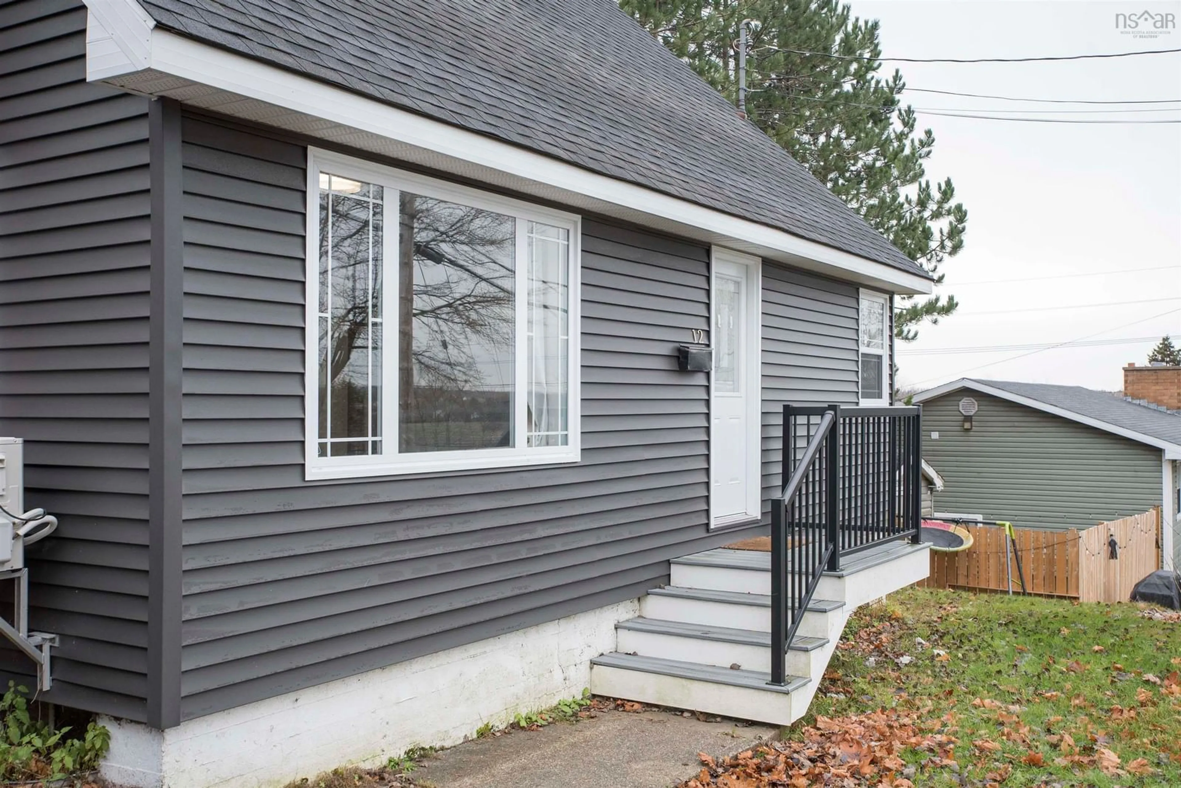 Home with vinyl exterior material, street for 12 Lynch, Sydney River Nova Scotia B1S 1V2