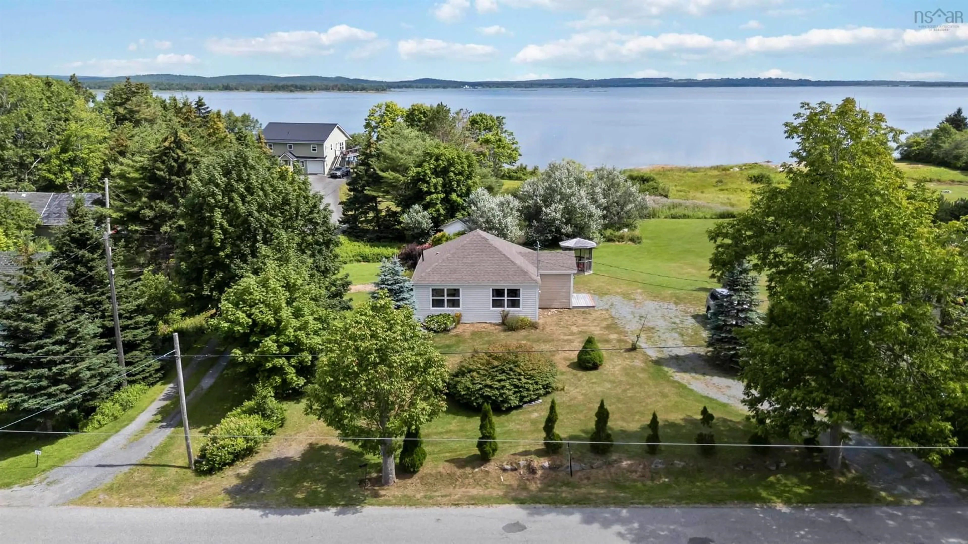 A pic from outside/outdoor area/front of a property/back of a property/a pic from drone, water/lake/river/ocean view for 117 Long Cove Road, Port Medway Nova Scotia B0J 2T0