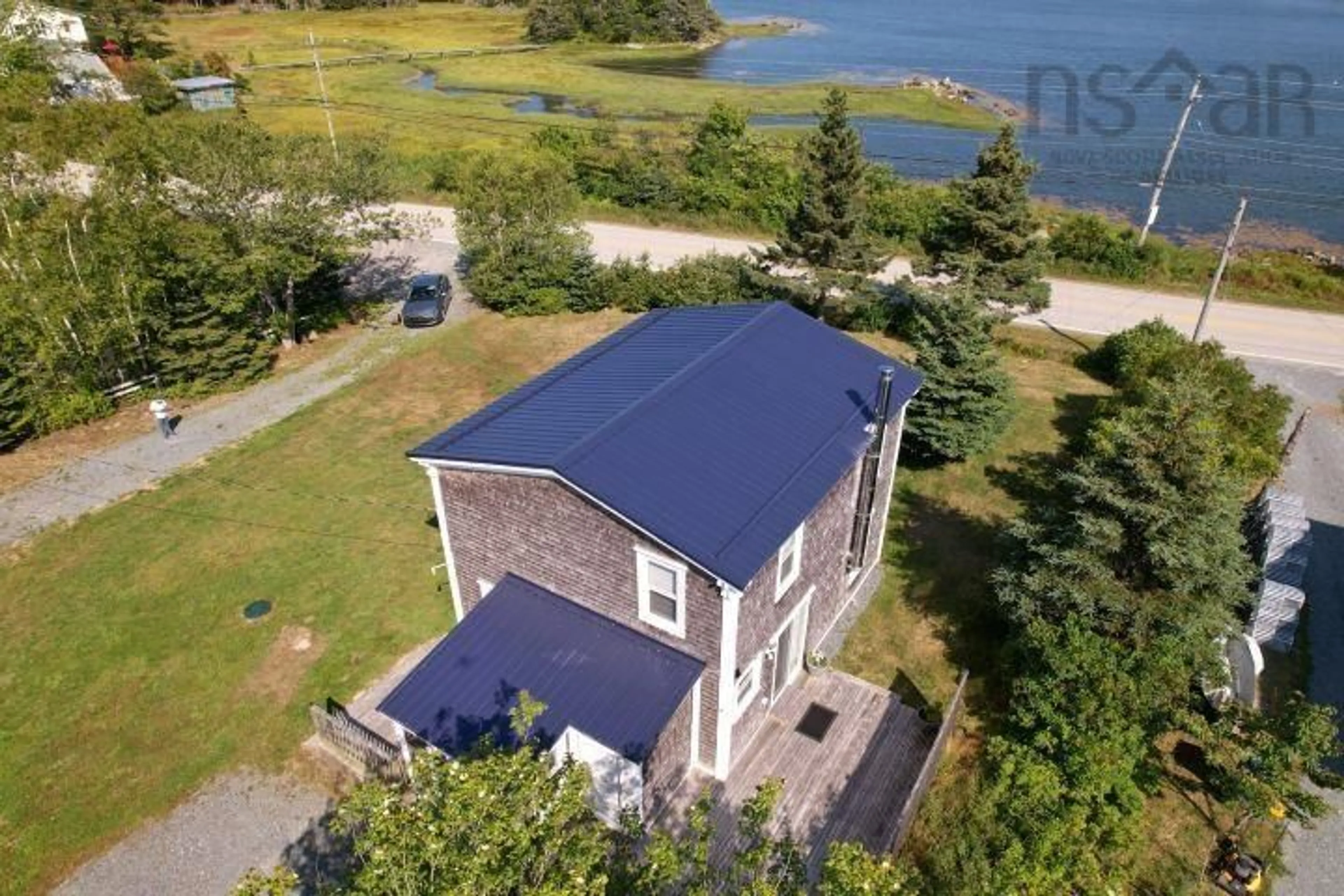 A pic from outside/outdoor area/front of a property/back of a property/a pic from drone, water/lake/river/ocean view for 4760 Highway 331, West Dublin Nova Scotia B0R 1C8