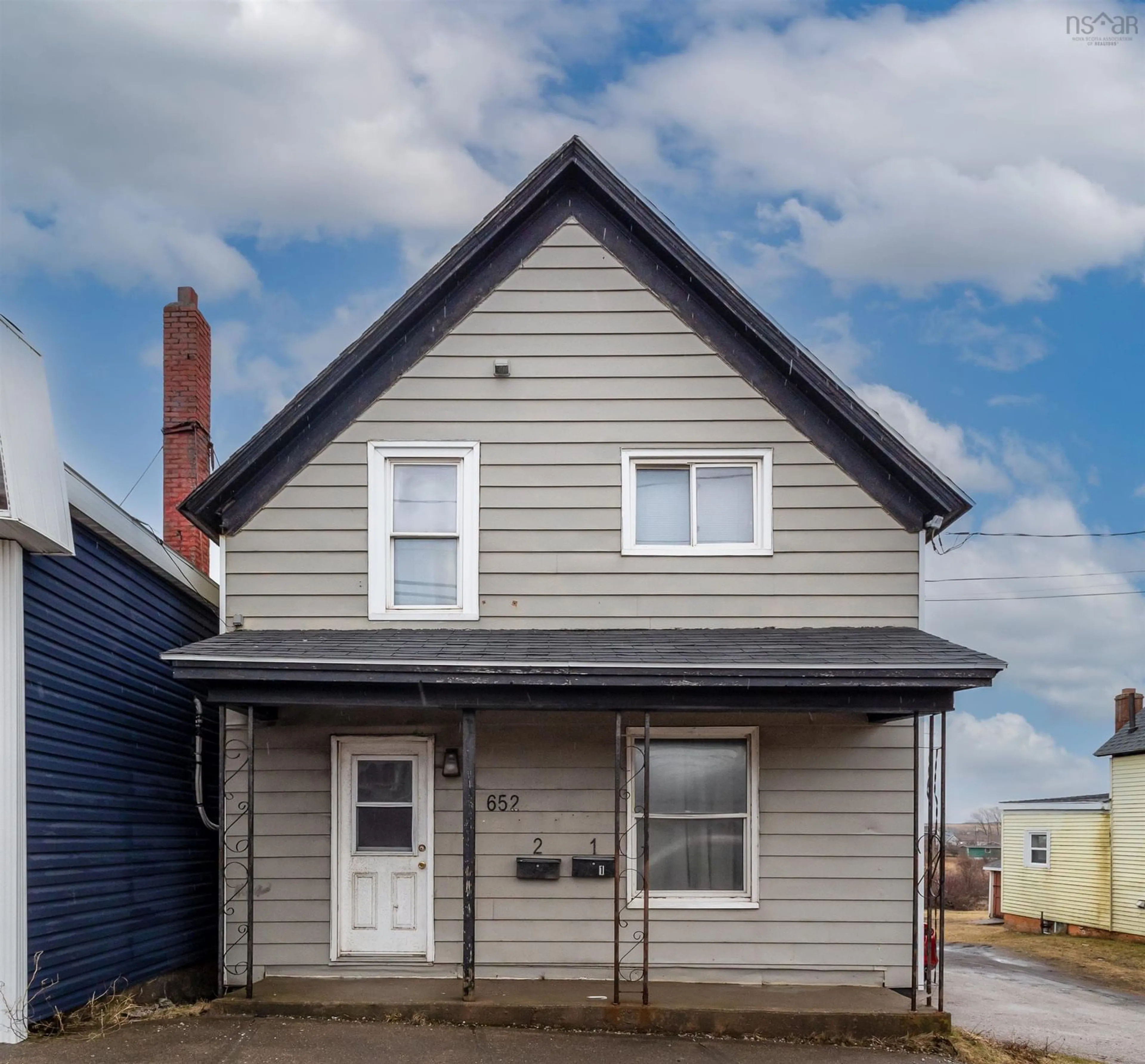 Home with vinyl exterior material, street for 652 Victoria Rd, Sydney Nova Scotia B1N 1H7