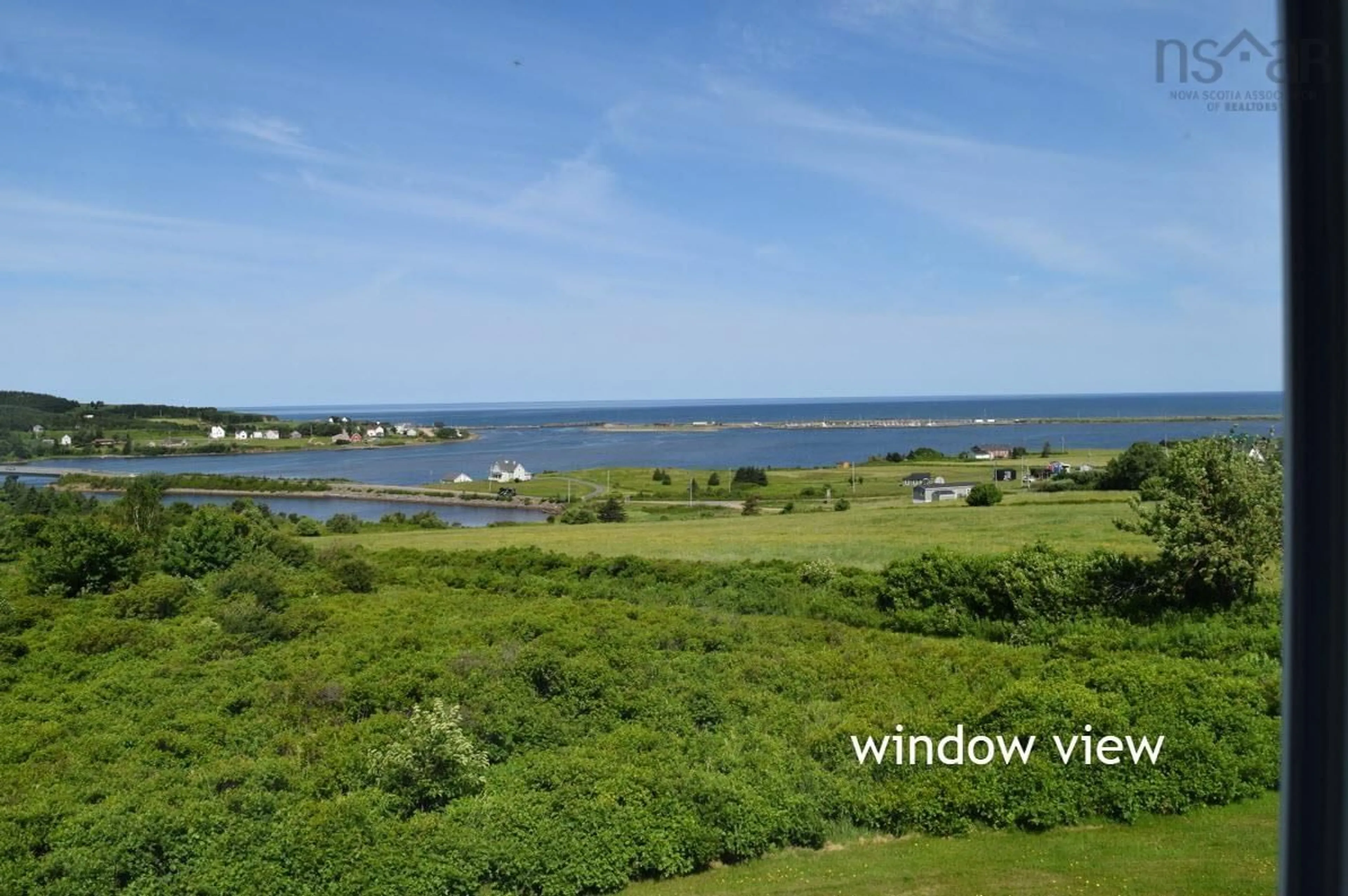 A pic from outside/outdoor area/front of a property/back of a property/a pic from drone, water/lake/river/ocean view for 70 South Cormier Rd, Belle Côte Nova Scotia B0E 1C0