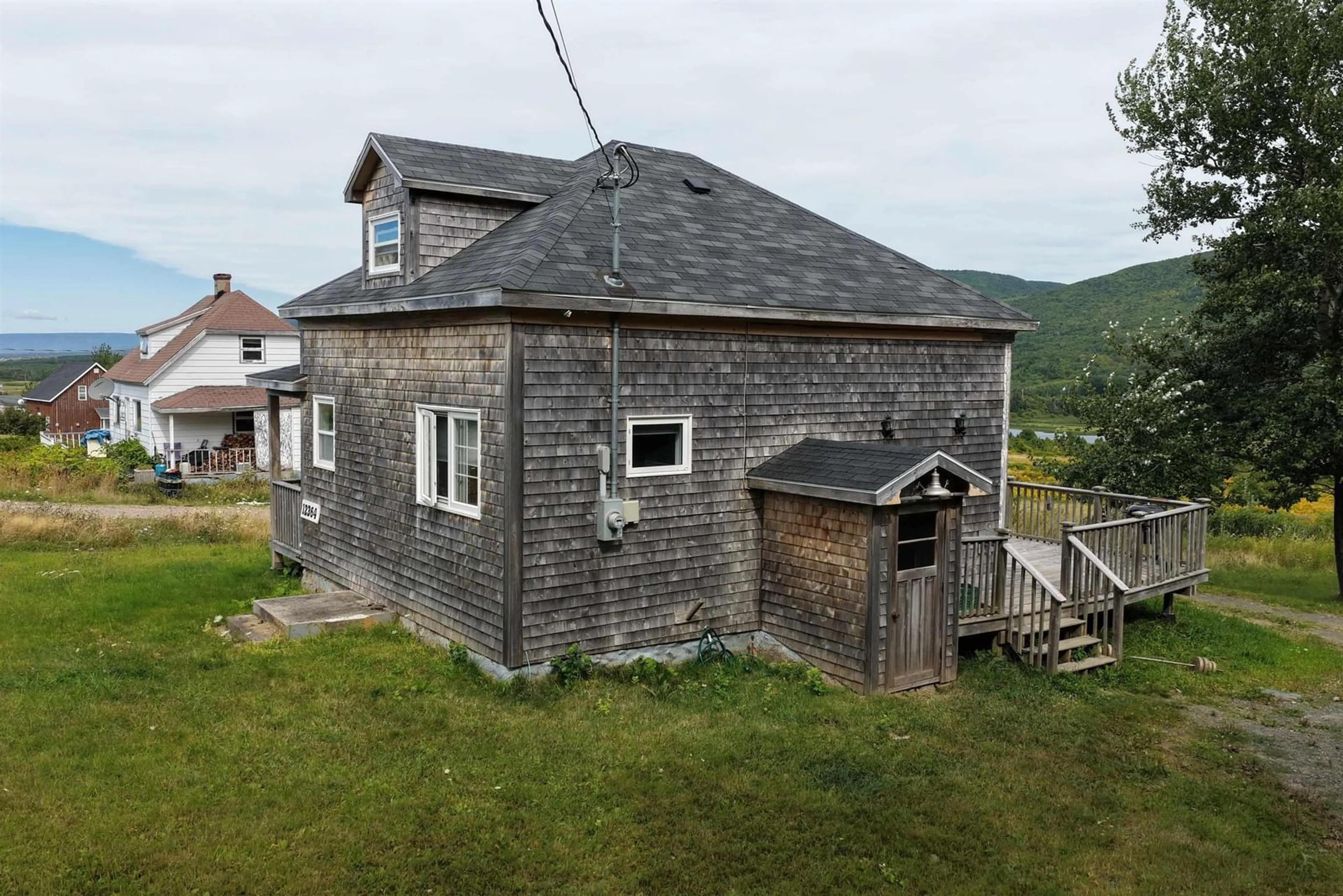 A pic from outside/outdoor area/front of a property/back of a property/a pic from drone, building for 12364 Cabot Trail, St. Joseph du Moine Nova Scotia B0E 3A0