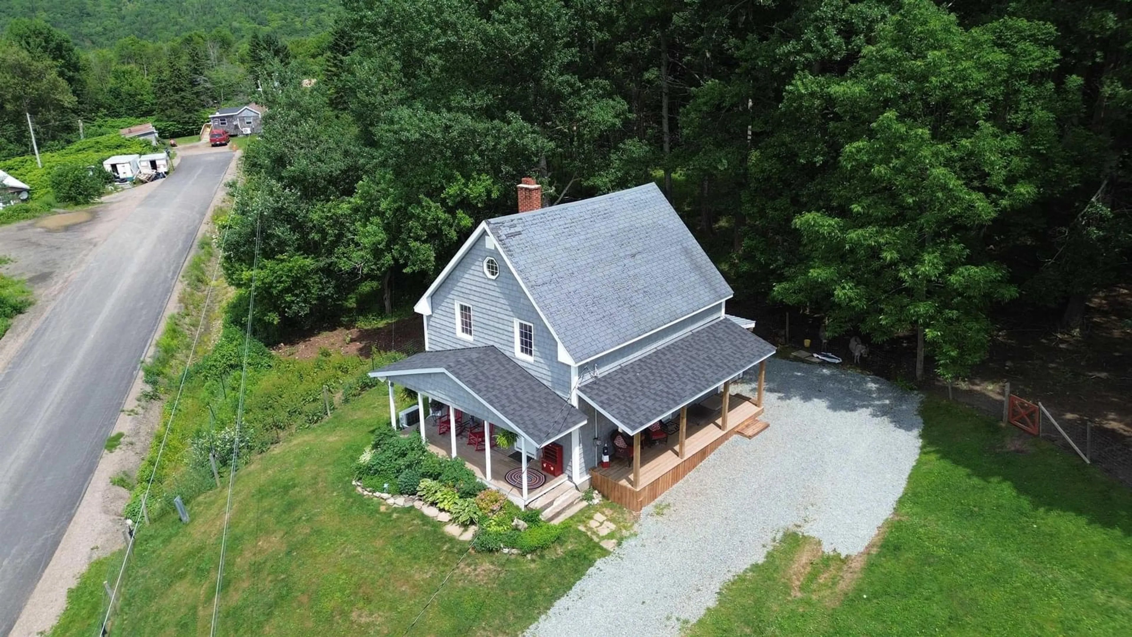 A pic from outside/outdoor area/front of a property/back of a property/a pic from drone, building for 230 Arsenaults Hill Rd, Margaree Nova Scotia B0E 2B0