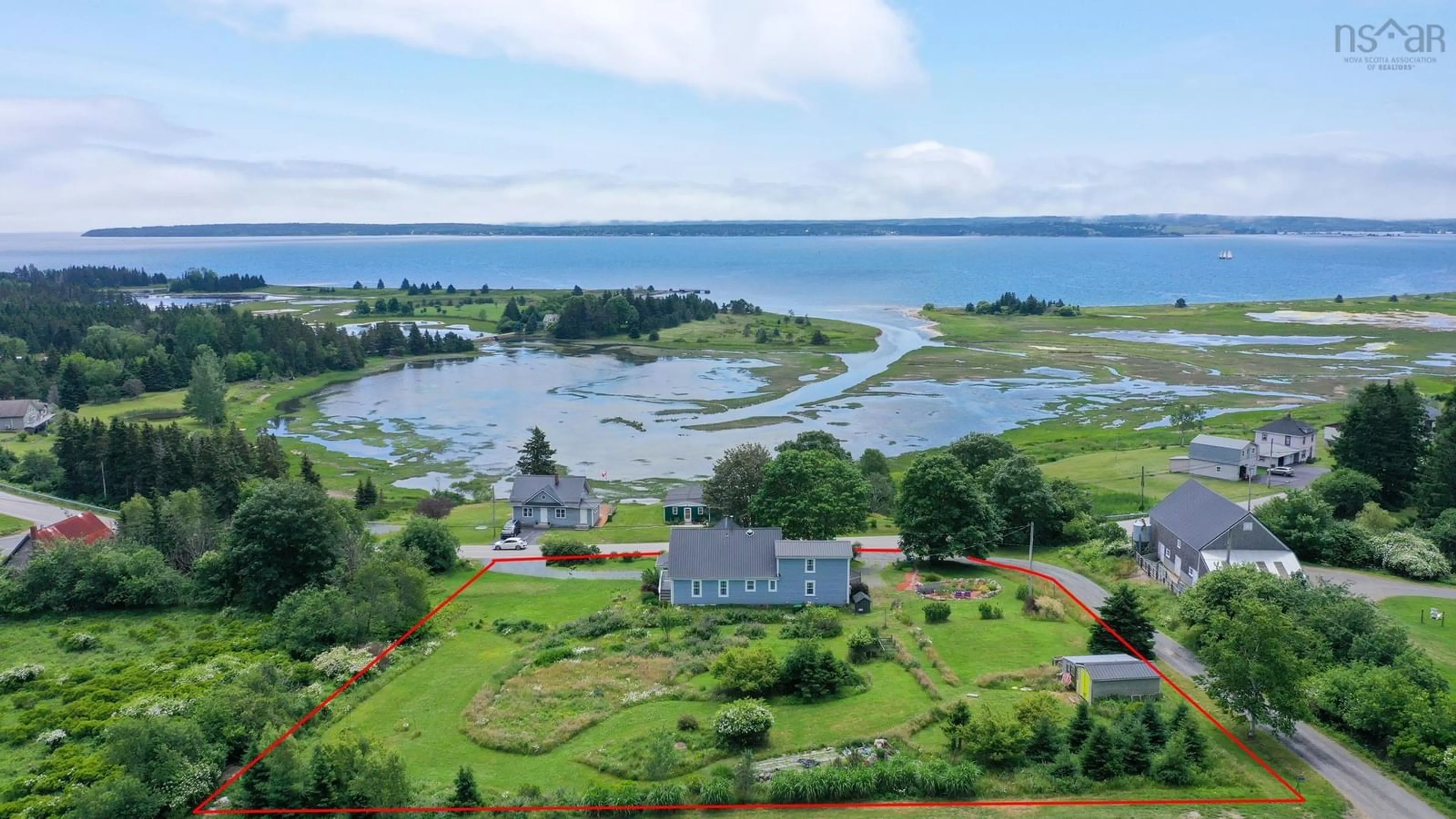 A pic from outside/outdoor area/front of a property/back of a property/a pic from drone, water/lake/river/ocean view for 647 Blue Rocks Rd, Garden Lots Nova Scotia B0J 2C0