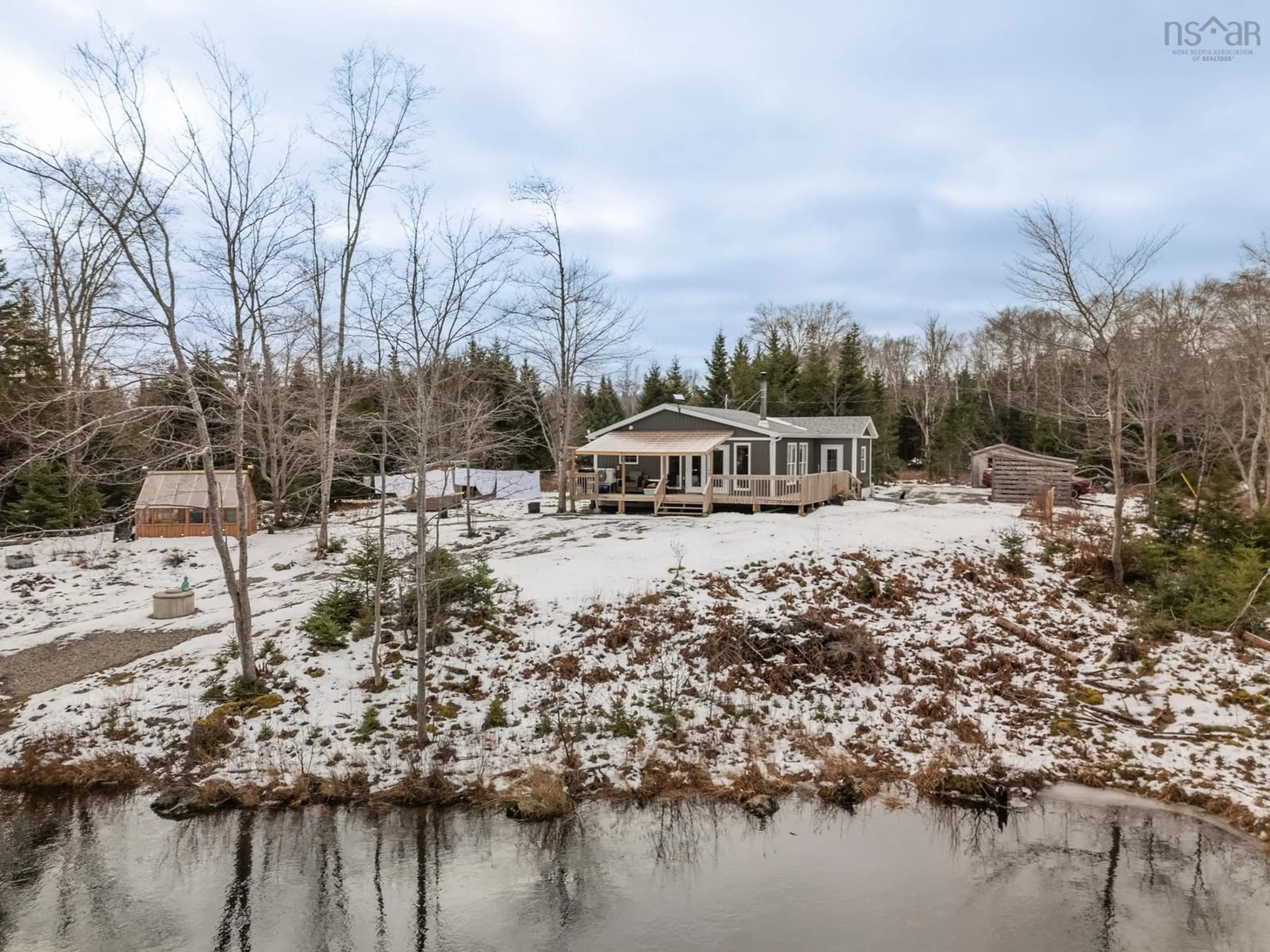 A pic from outside/outdoor area/front of a property/back of a property/a pic from drone, water/lake/river/ocean view for 55 Carleton River Rd, Carleton Nova Scotia B5A 0H3