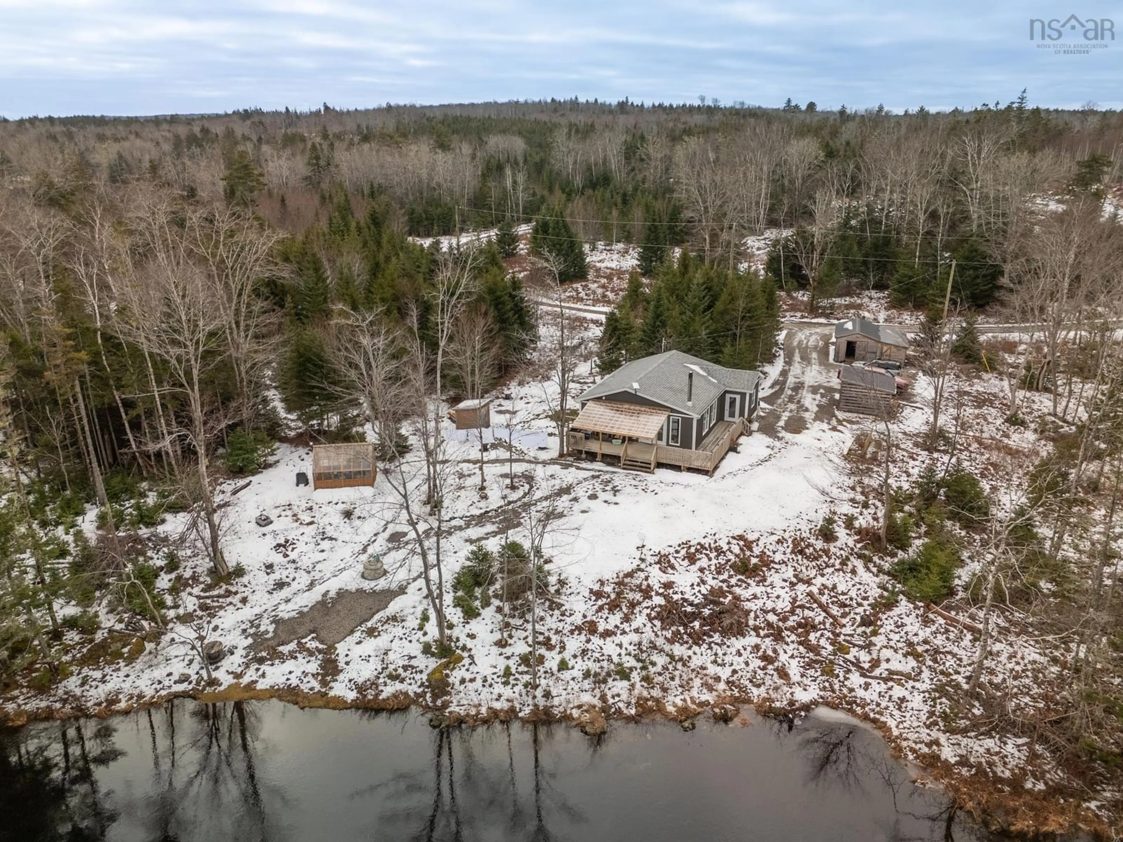 A pic from outside/outdoor area/front of a property/back of a property/a pic from drone, water/lake/river/ocean view for 55 Carleton River Rd, Carleton Nova Scotia B5A 0H3
