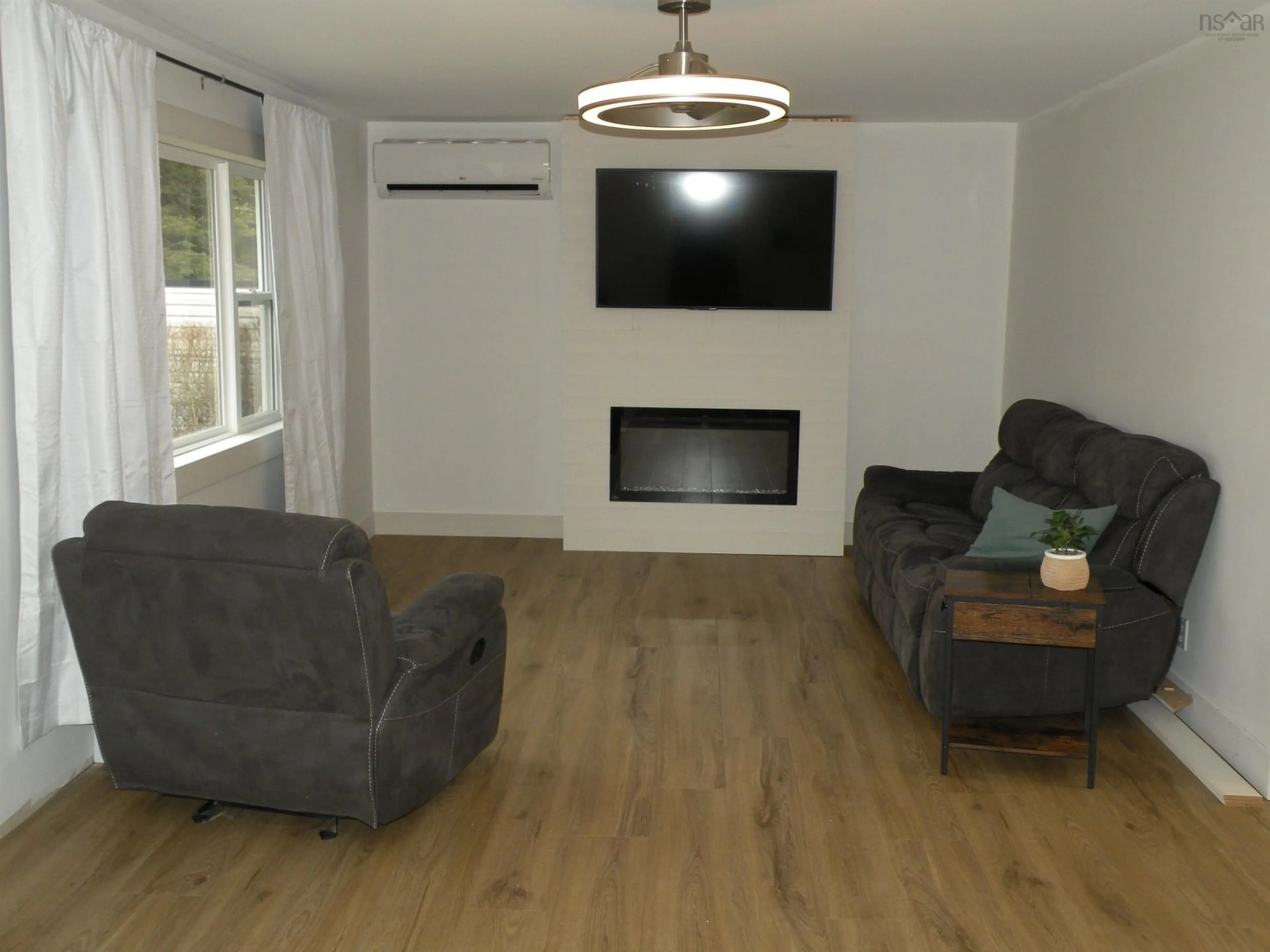 Living room with furniture, wood/laminate floor for 56 Mansion Ave, Halifax Nova Scotia B3R 1E2