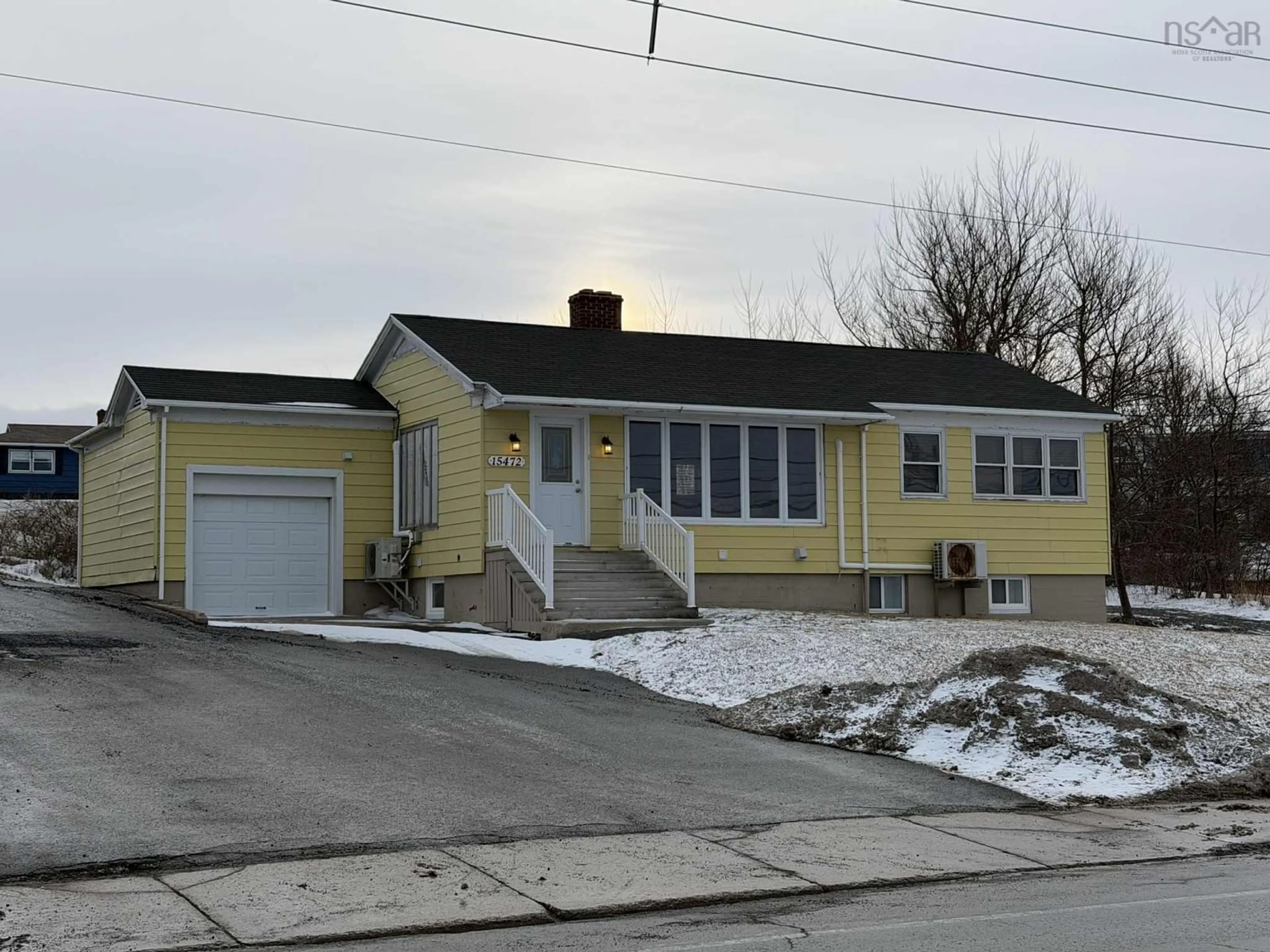 Home with vinyl exterior material, street for 15472 Cabot Trail, Chéticamp Nova Scotia B0E 1H0