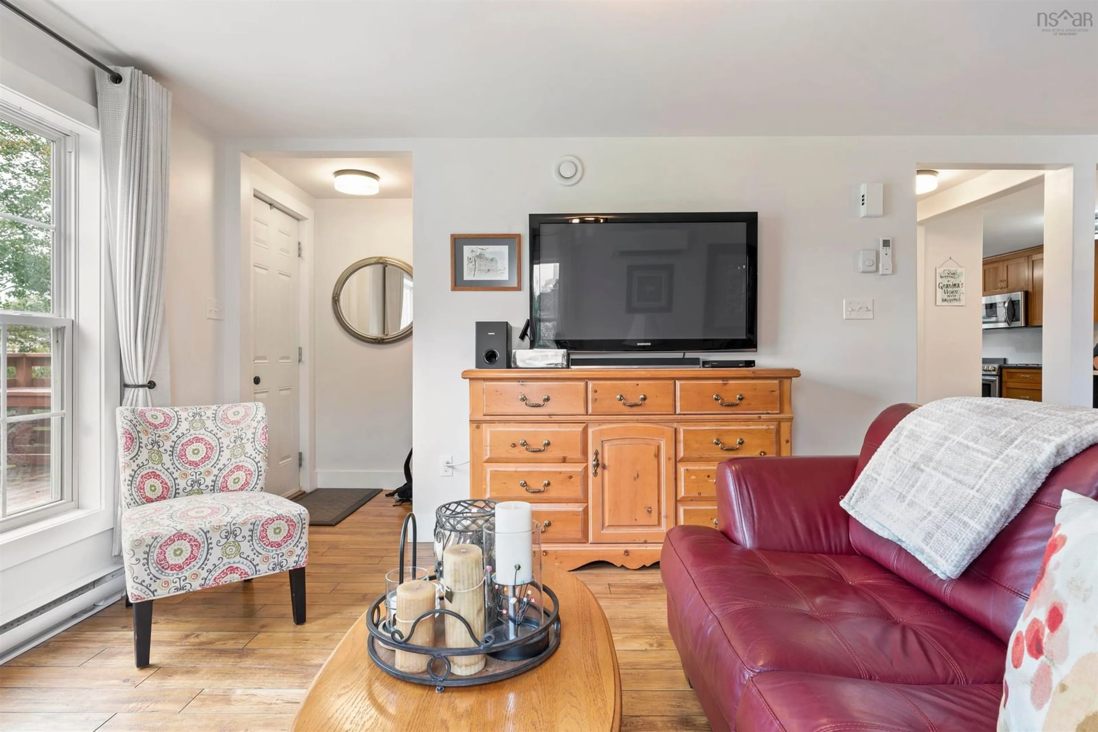 Living room with furniture, wood/laminate floor for 57 Highway 336, Upper Musquodoboit Nova Scotia B0N 2M0