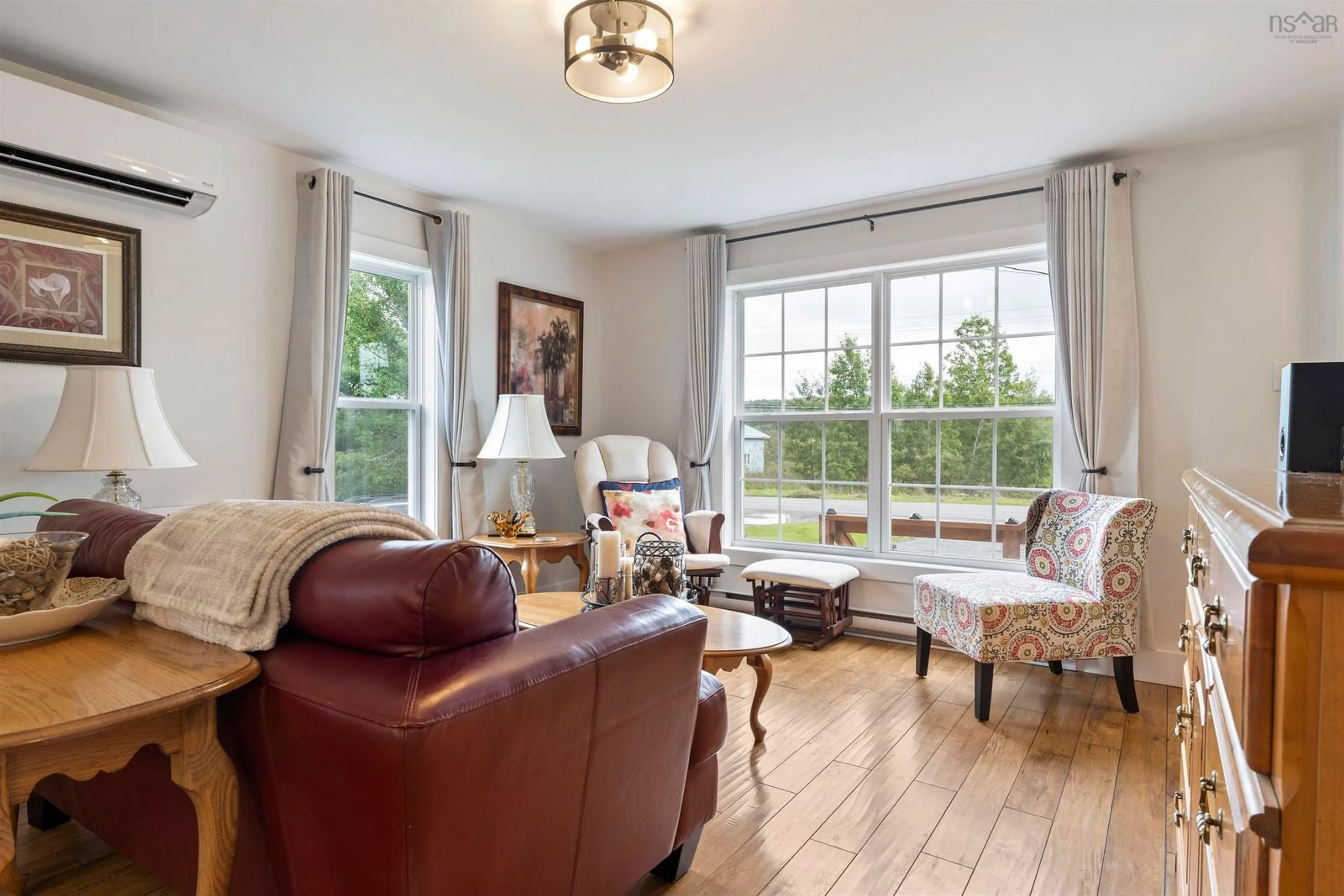Living room with furniture, wood/laminate floor for 57 Highway 336, Upper Musquodoboit Nova Scotia B0N 2M0