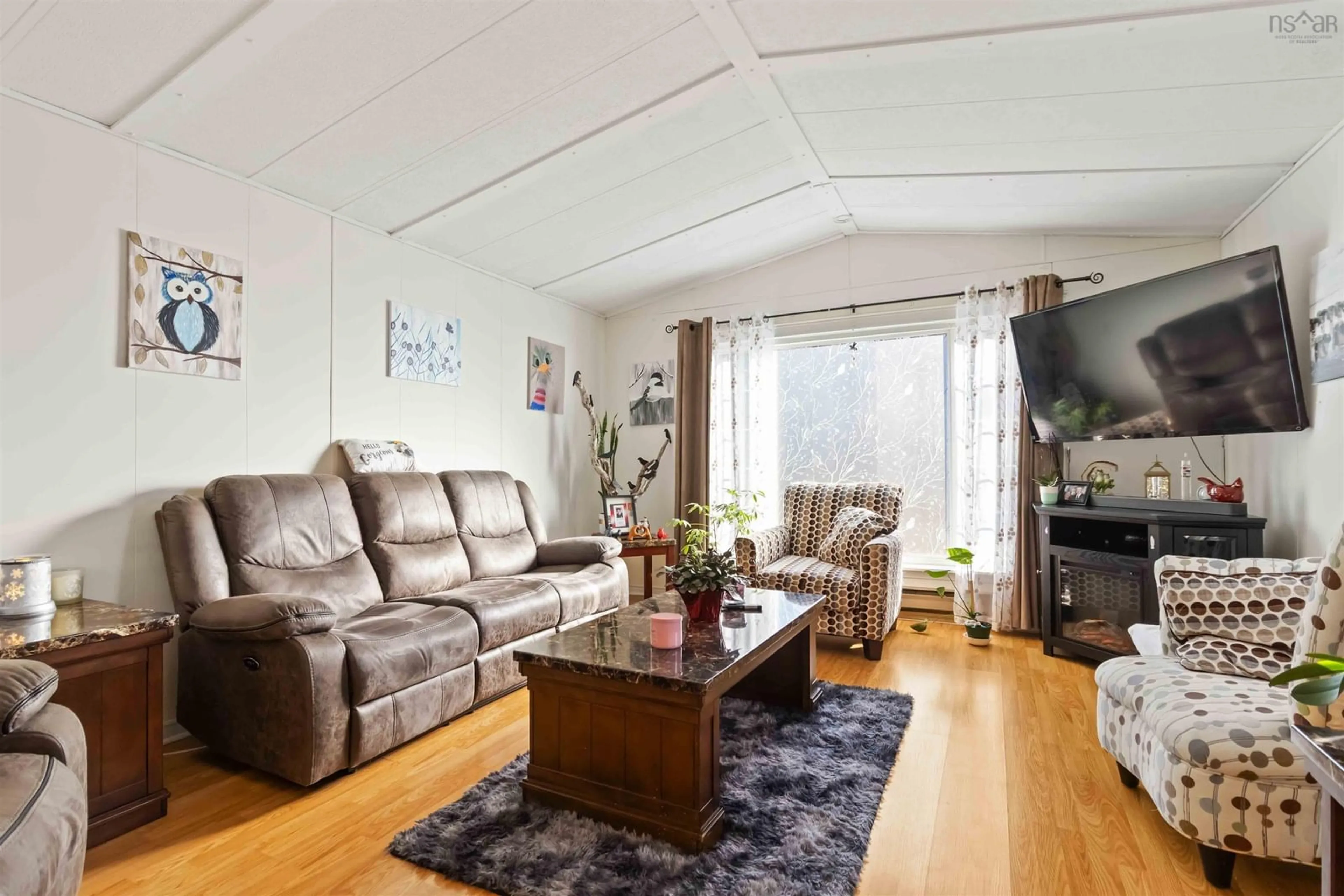 Living room with furniture, wood/laminate floor for 2 Stanley St, Middle Sackville Nova Scotia B4E 1E8