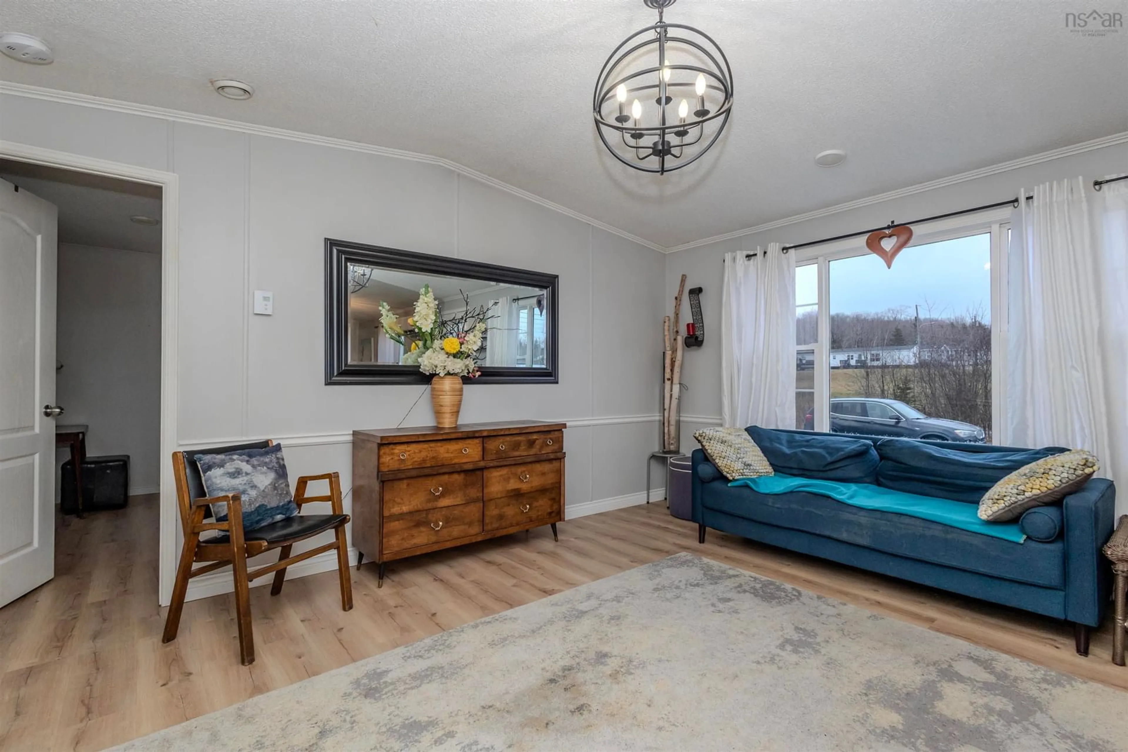 Living room with furniture, wood/laminate floor for 8 Park St, Howie Centre Nova Scotia B1J 2A9