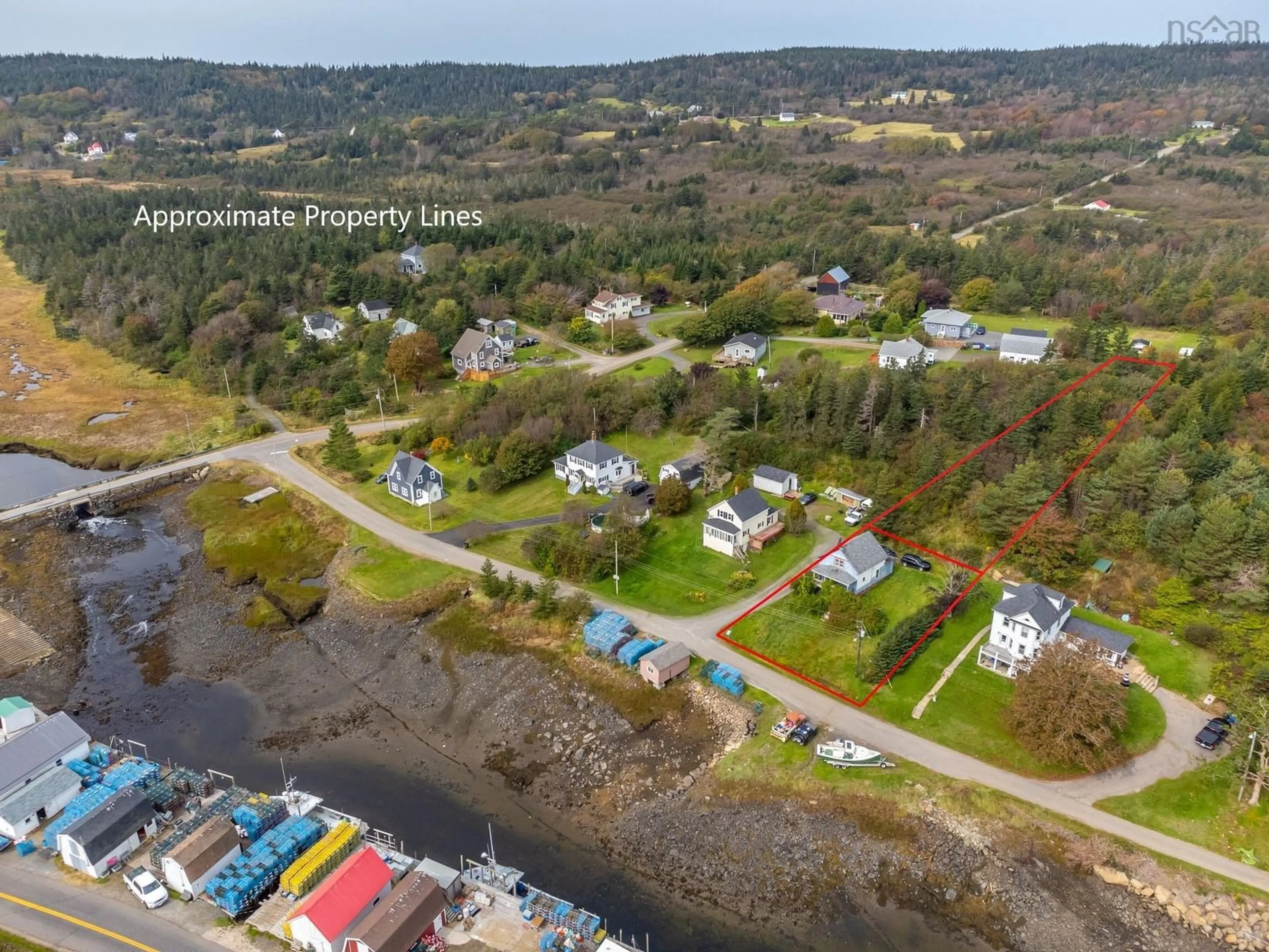 A pic from outside/outdoor area/front of a property/back of a property/a pic from drone, water/lake/river/ocean view for 27 Eastern Head, Little River Nova Scotia B0V 1C0
