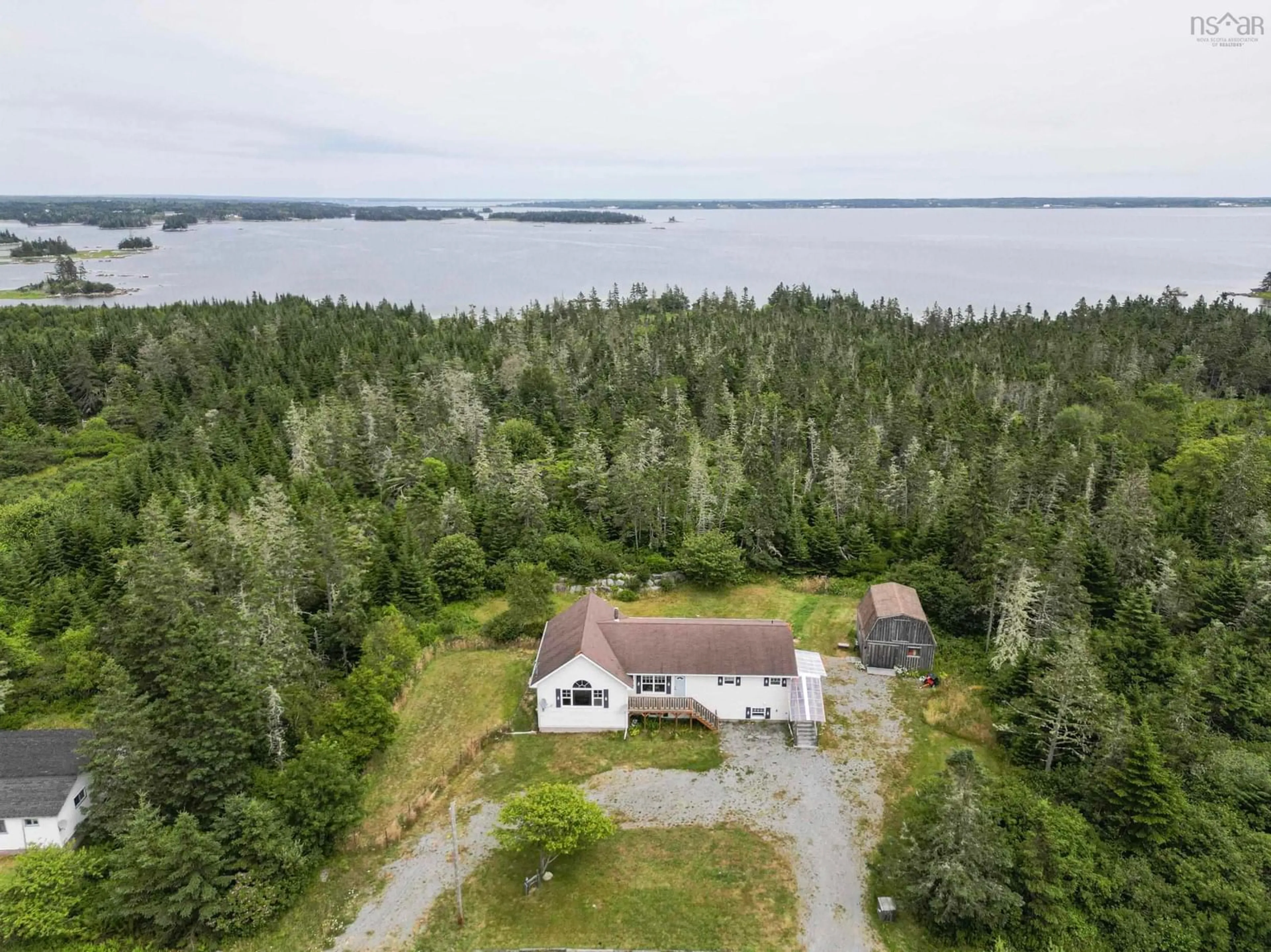 A pic from outside/outdoor area/front of a property/back of a property/a pic from drone, water/lake/river/ocean view for 113 Bear Point Rd, Bear Point Nova Scotia B0W 3B0