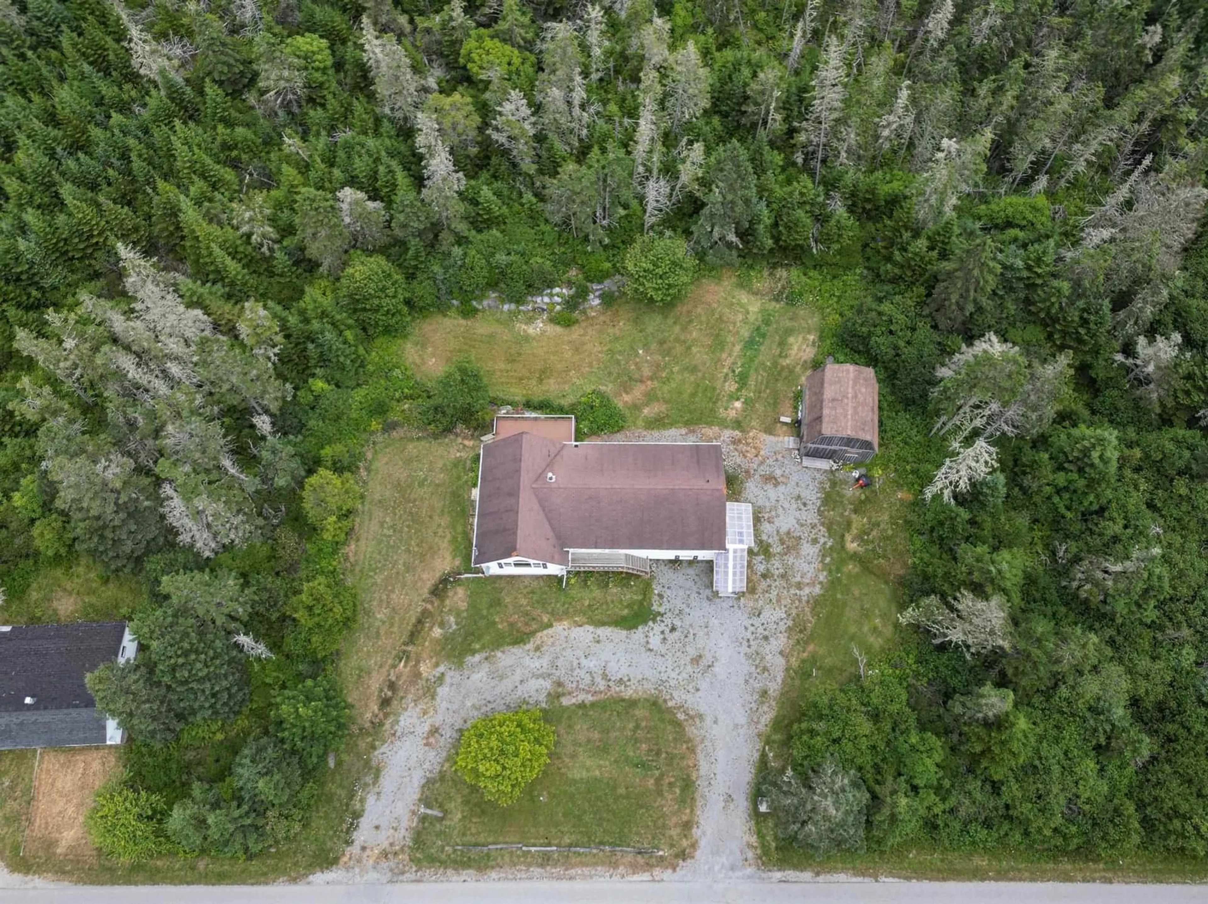 A pic from outside/outdoor area/front of a property/back of a property/a pic from drone, forest/trees view for 113 Bear Point Rd, Bear Point Nova Scotia B0W 3B0