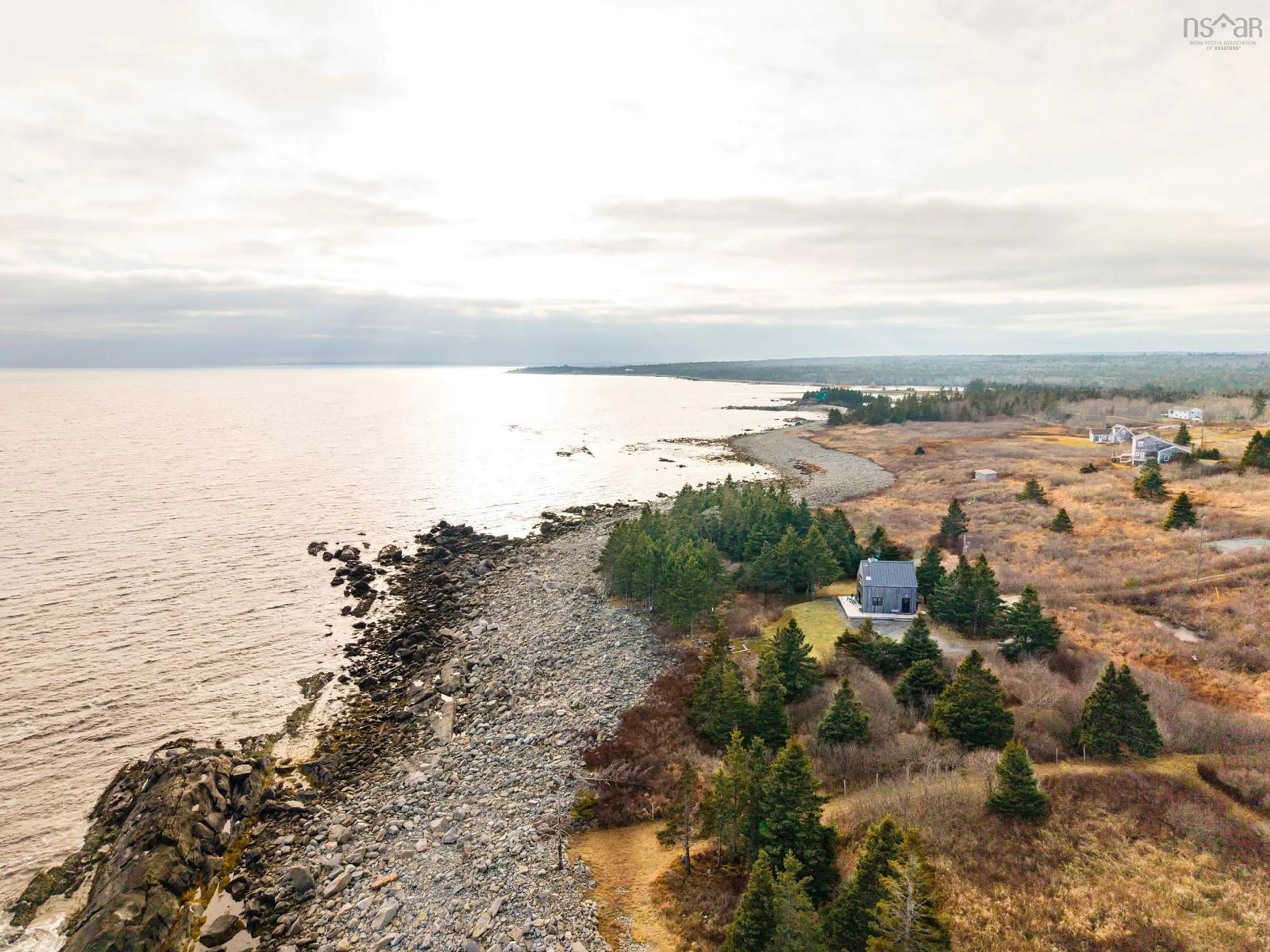 A pic from outside/outdoor area/front of a property/back of a property/a pic from drone, water/lake/river/ocean view for 77 Sand Beach Rd, Western Head Nova Scotia B0T 1K0