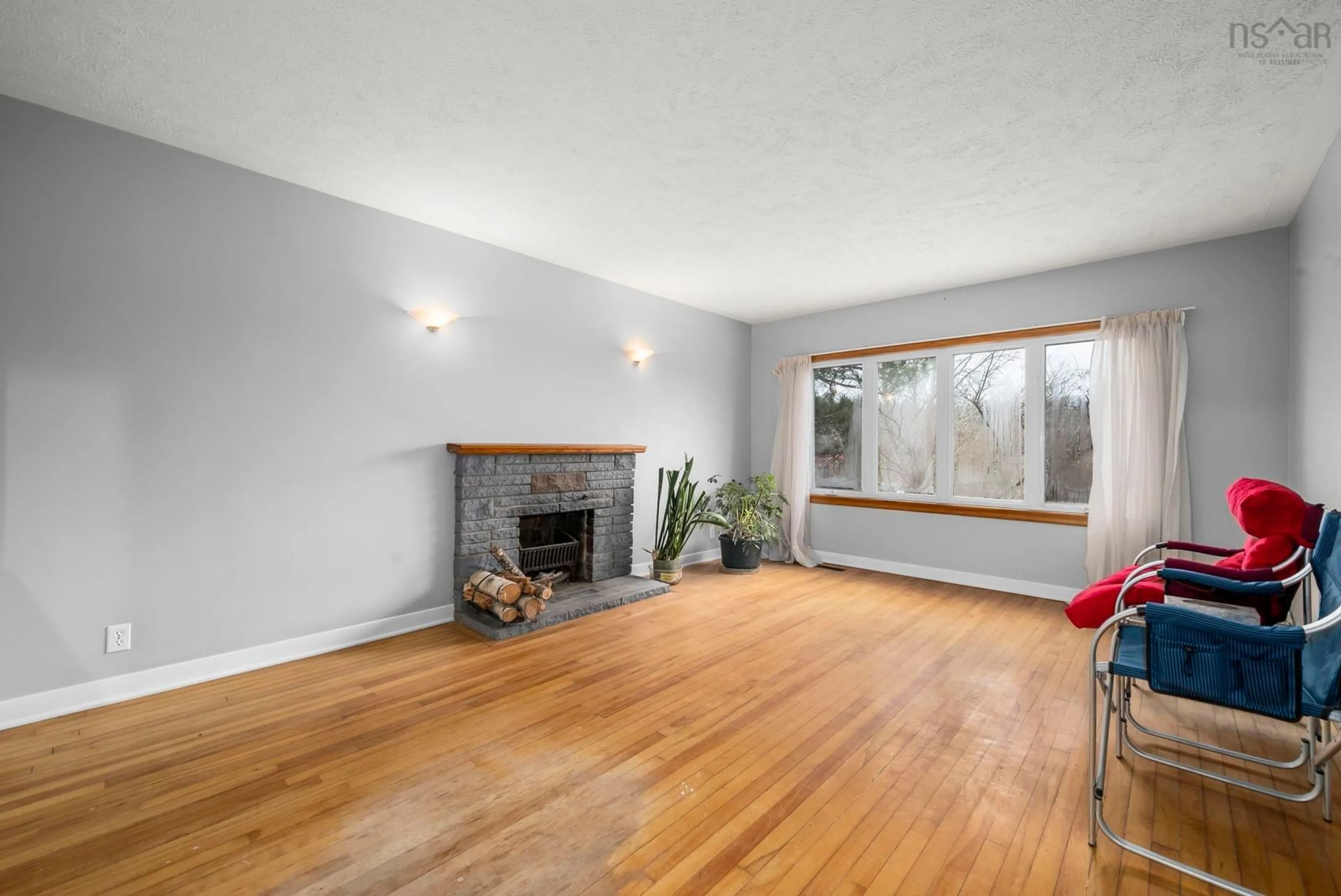Living room with furniture, wood/laminate floor for 282 Rocky Lake Dr, Bedford Nova Scotia B4A 2T2