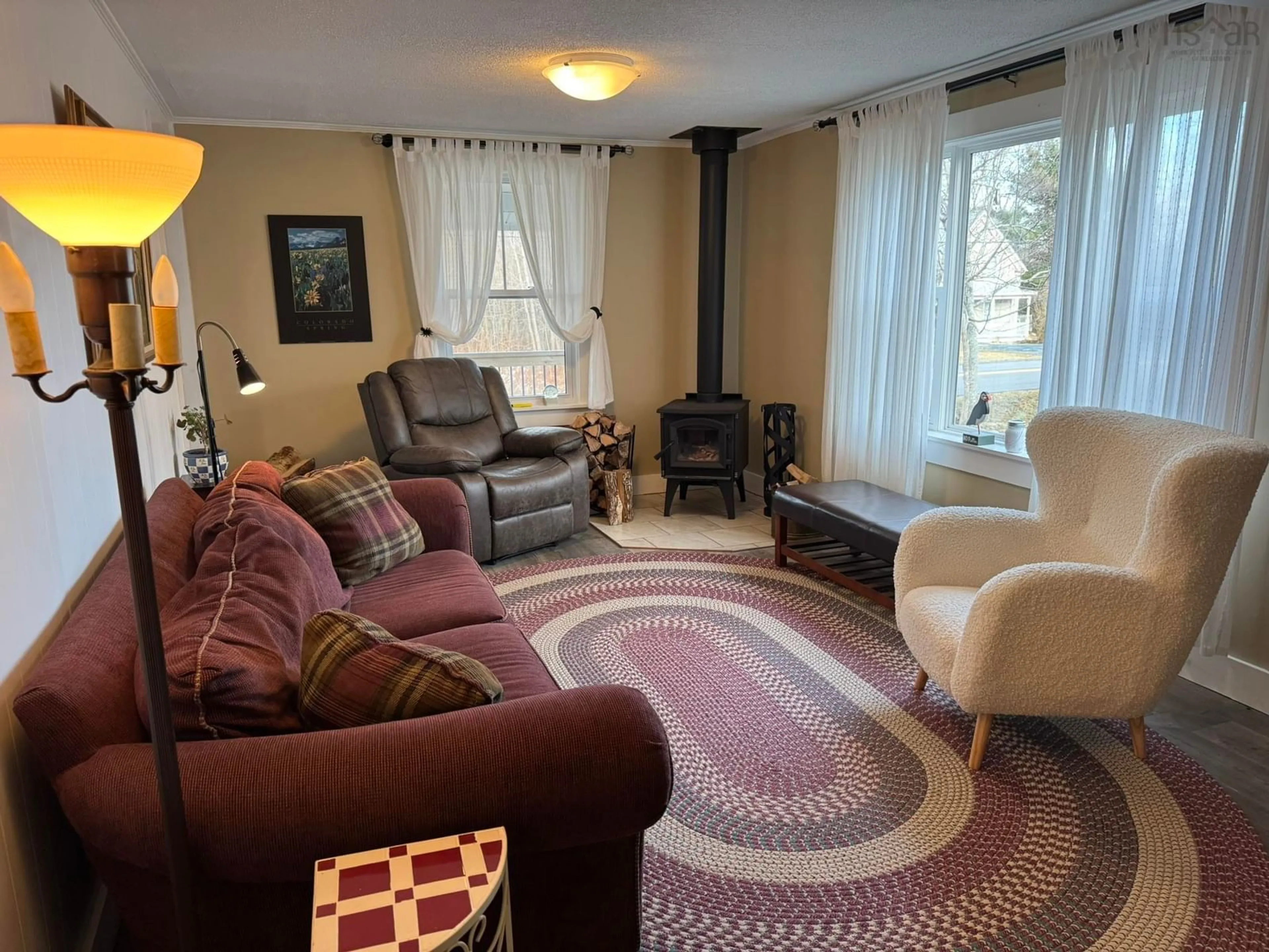 Living room with furniture, carpet floor for 178 Shore Rd, Mersey Point Nova Scotia B0T 1K0