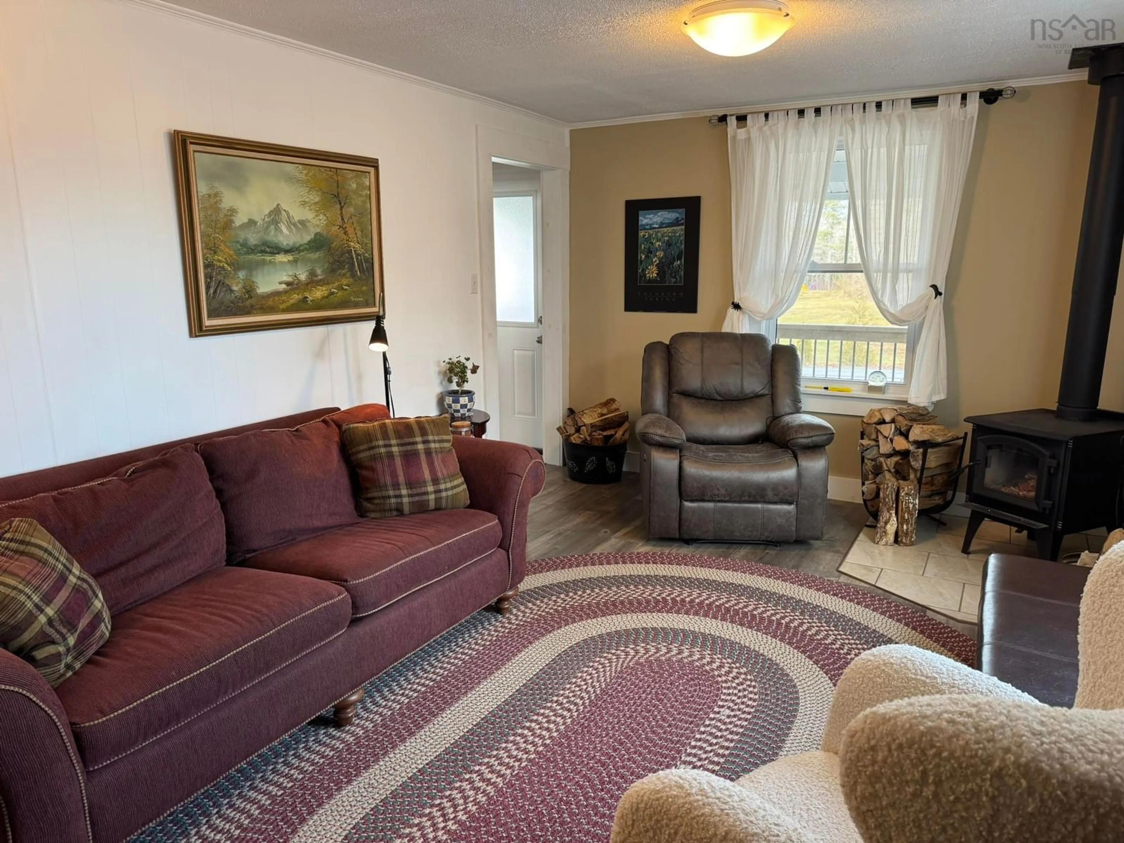 Living room with furniture, unknown for 178 Shore Rd, Mersey Point Nova Scotia B0T 1K0