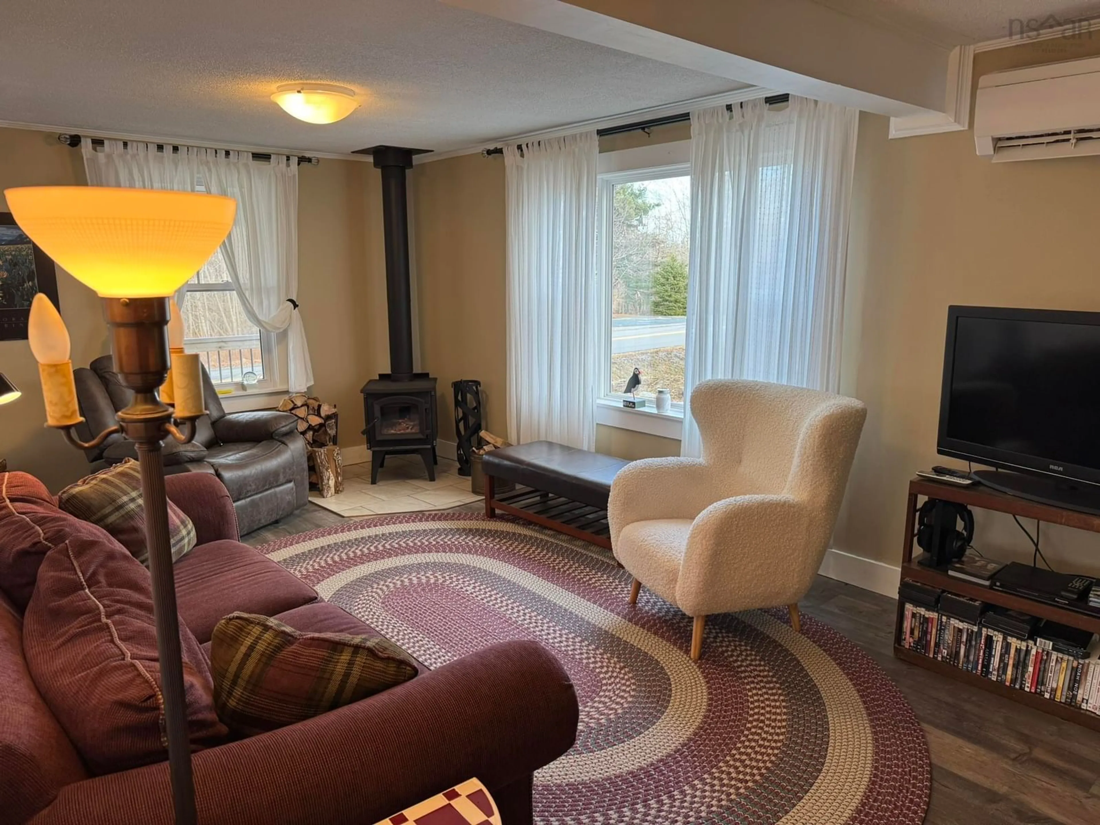 Living room with furniture, carpet floor for 178 Shore Rd, Mersey Point Nova Scotia B0T 1K0