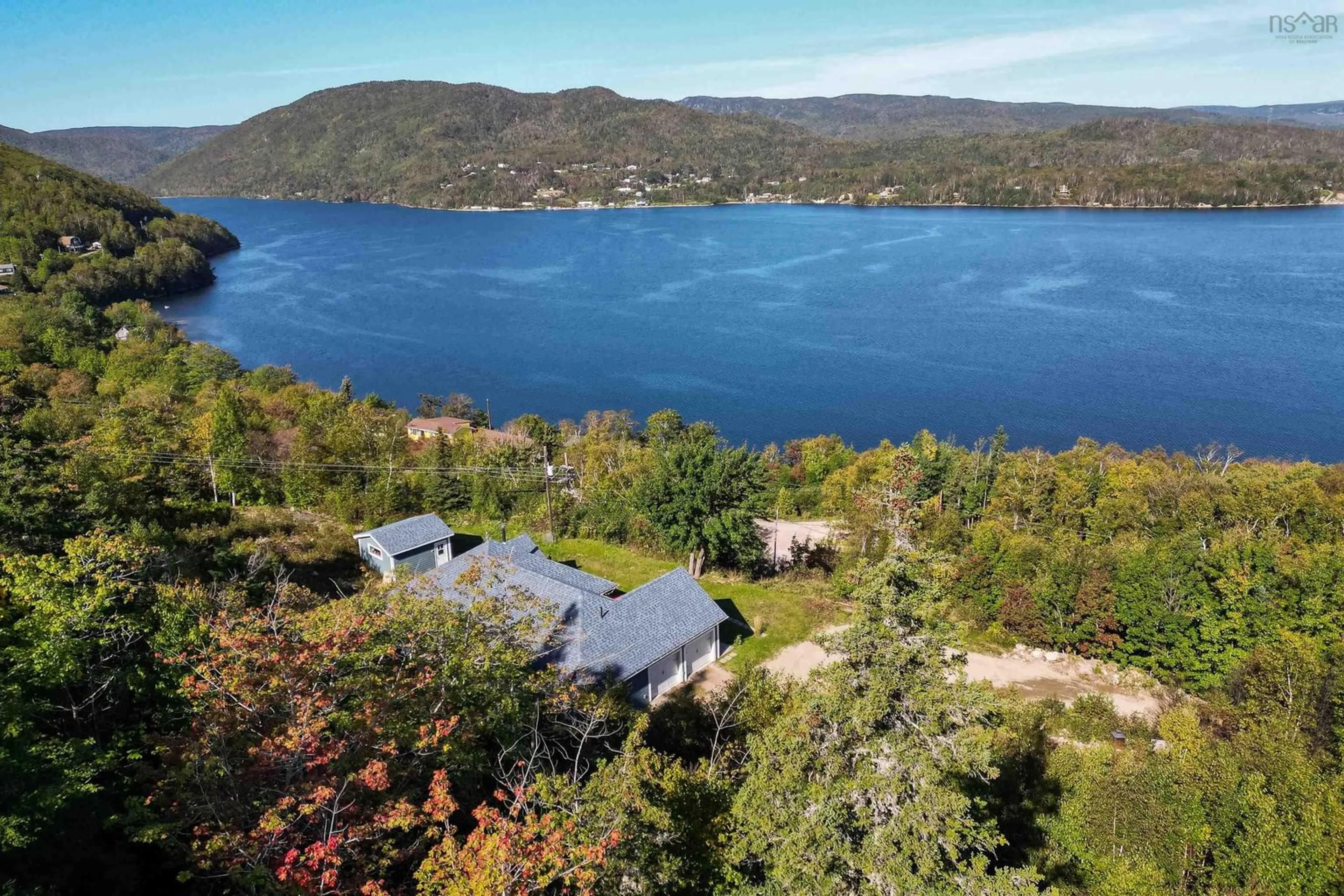 A pic from outside/outdoor area/front of a property/back of a property/a pic from drone, water/lake/river/ocean view for 39170 Cabot Trail Rd, Ingonish Nova Scotia B0C 1L0