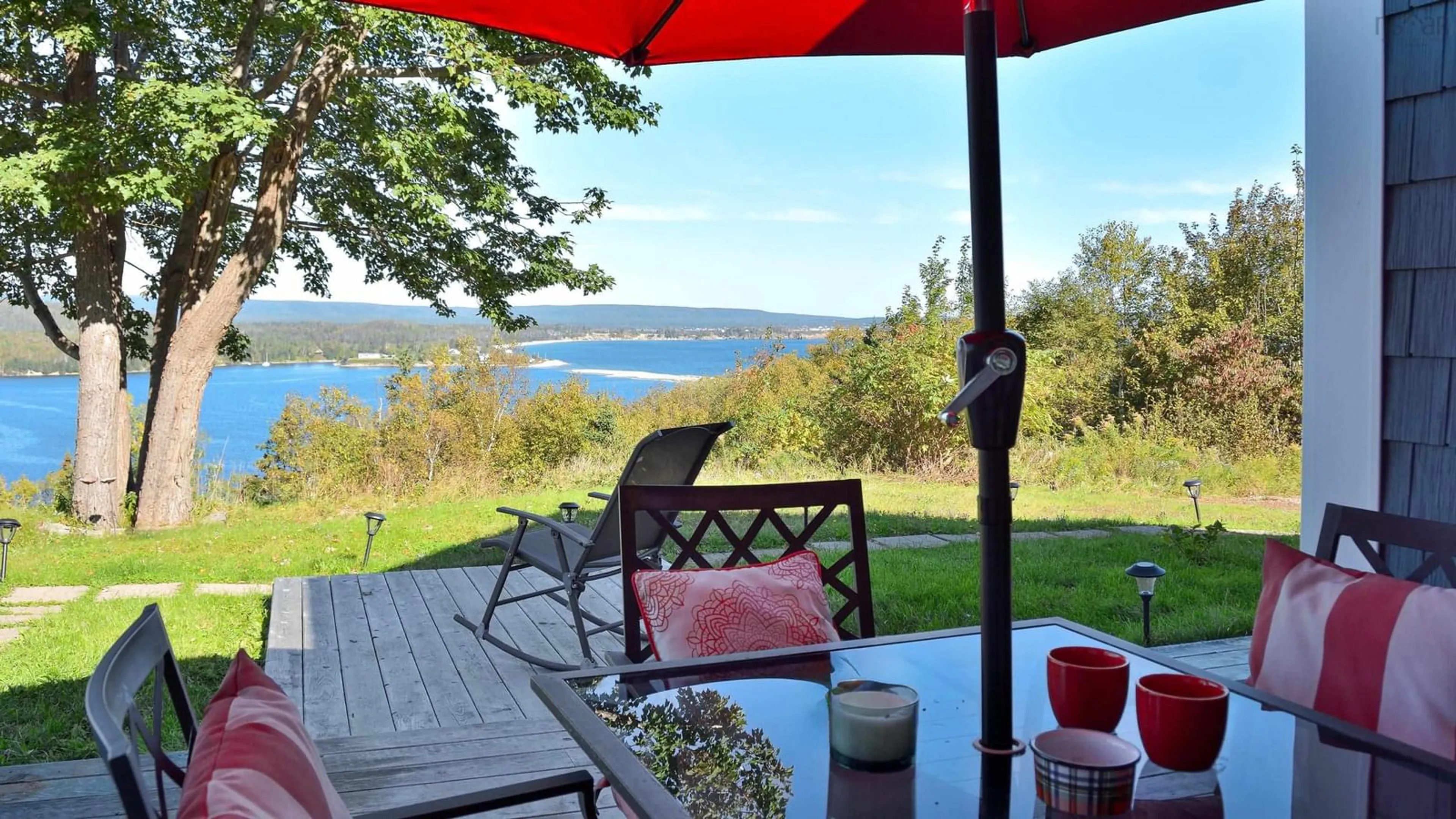 Patio, water/lake/river/ocean view for 39170 Cabot Trail Rd, Ingonish Nova Scotia B0C 1L0