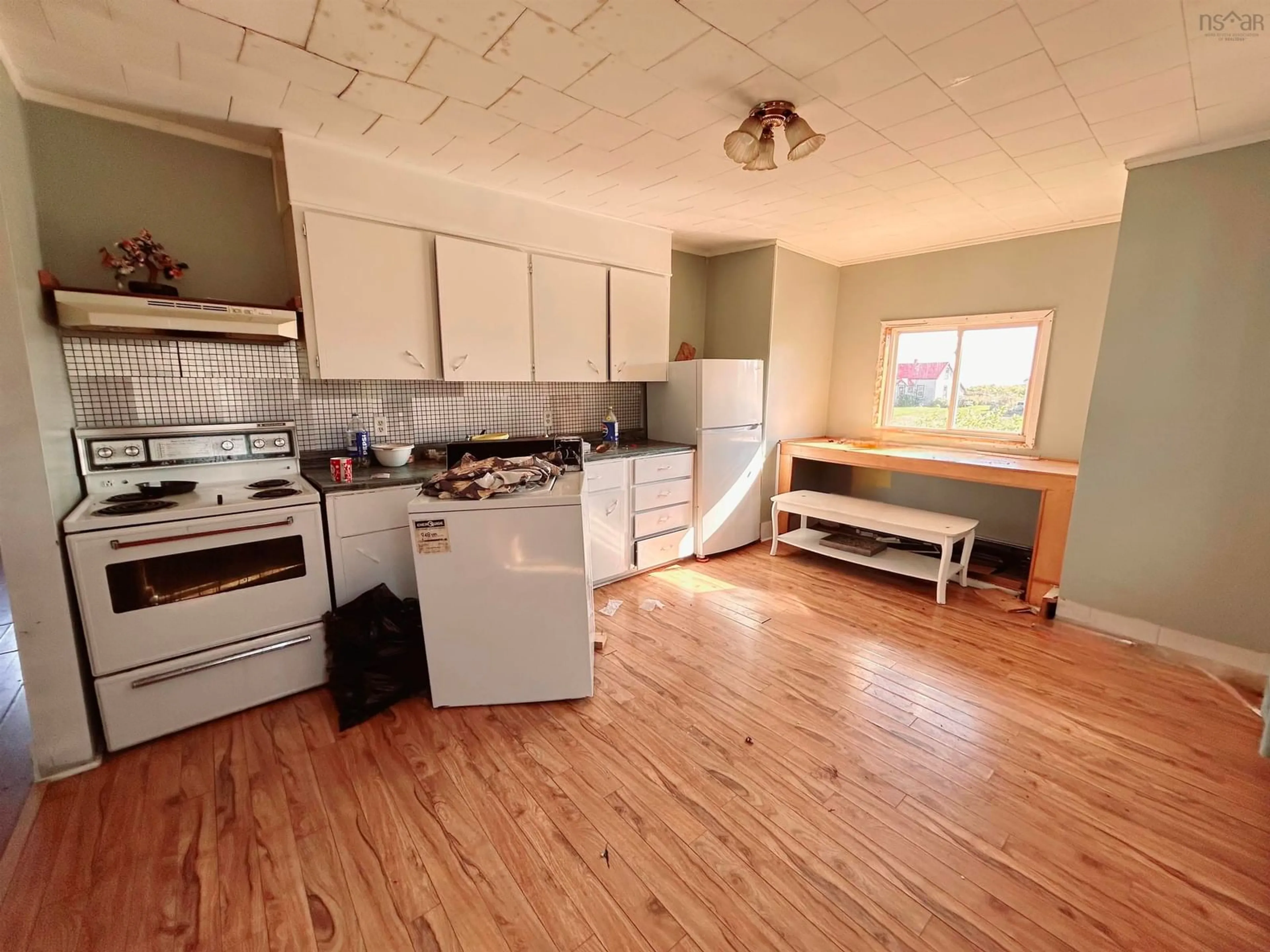 Standard kitchen, wood/laminate floor for 9 Peach St, Port Morien Nova Scotia B1B 1E3